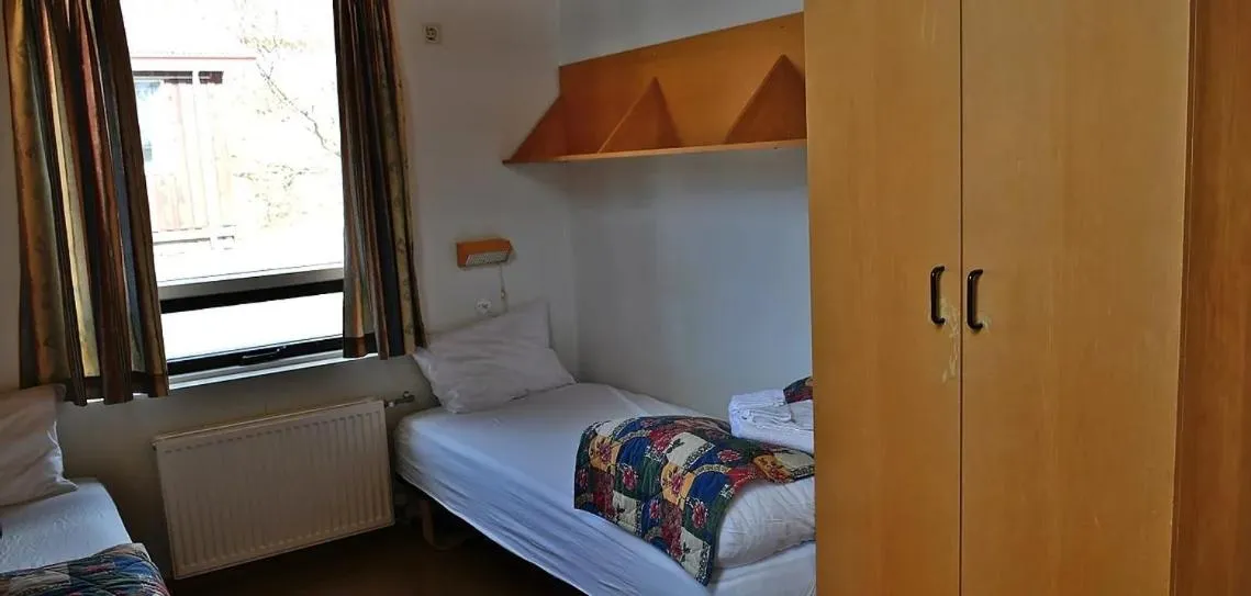 Bedroom in Kaffi Holar Cottages and Apartments