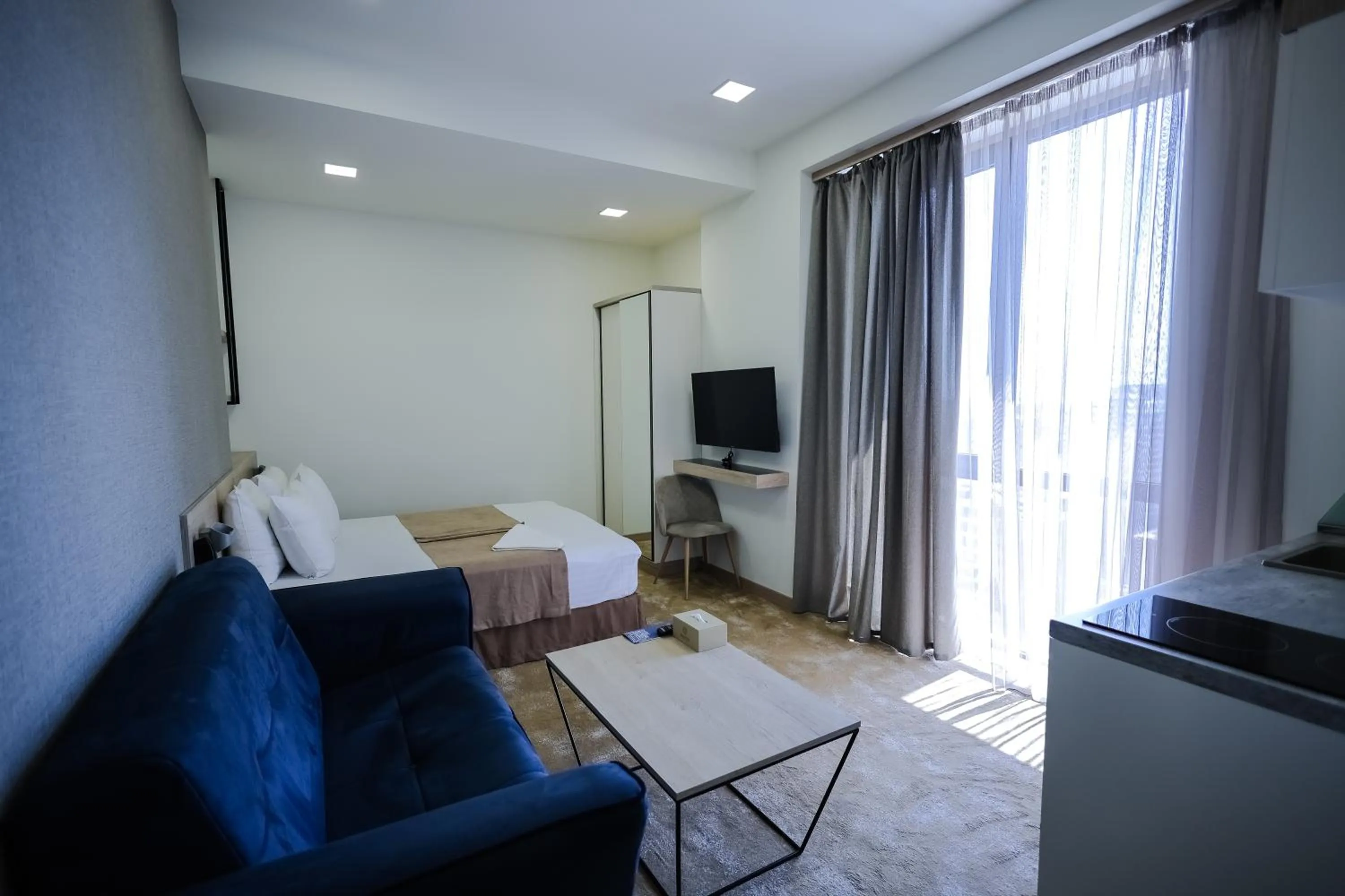 Photo of the whole room, Bed in Rooftop Apart-Hotel