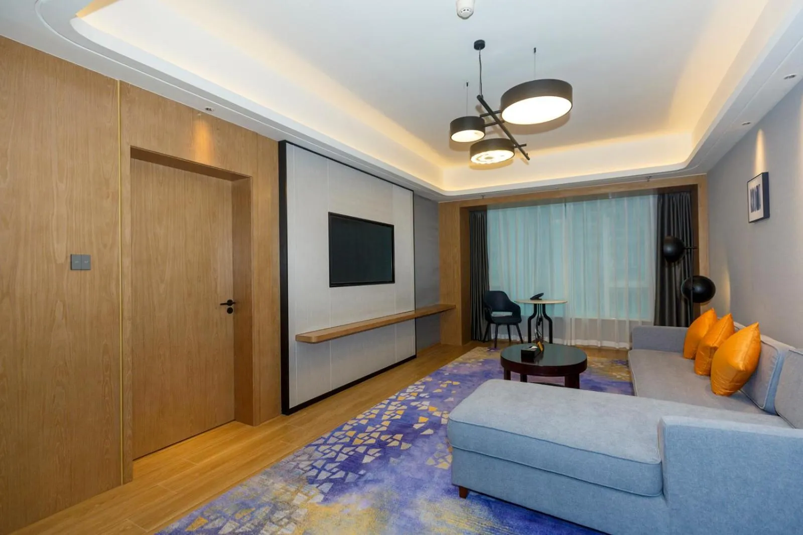 Living room in voco Guangzhou Shifu by IHG