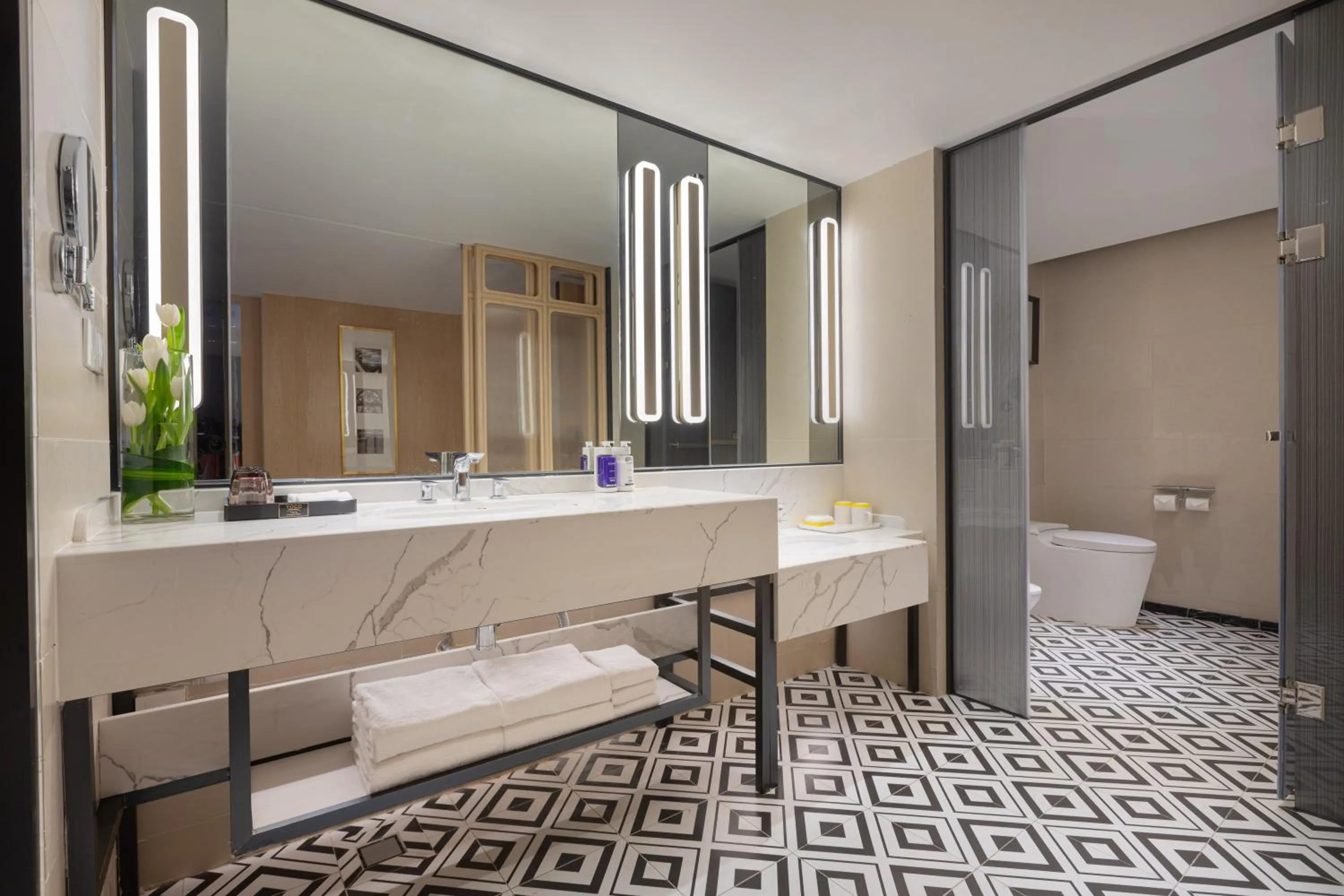 Bathroom in voco Guangzhou Shifu by IHG