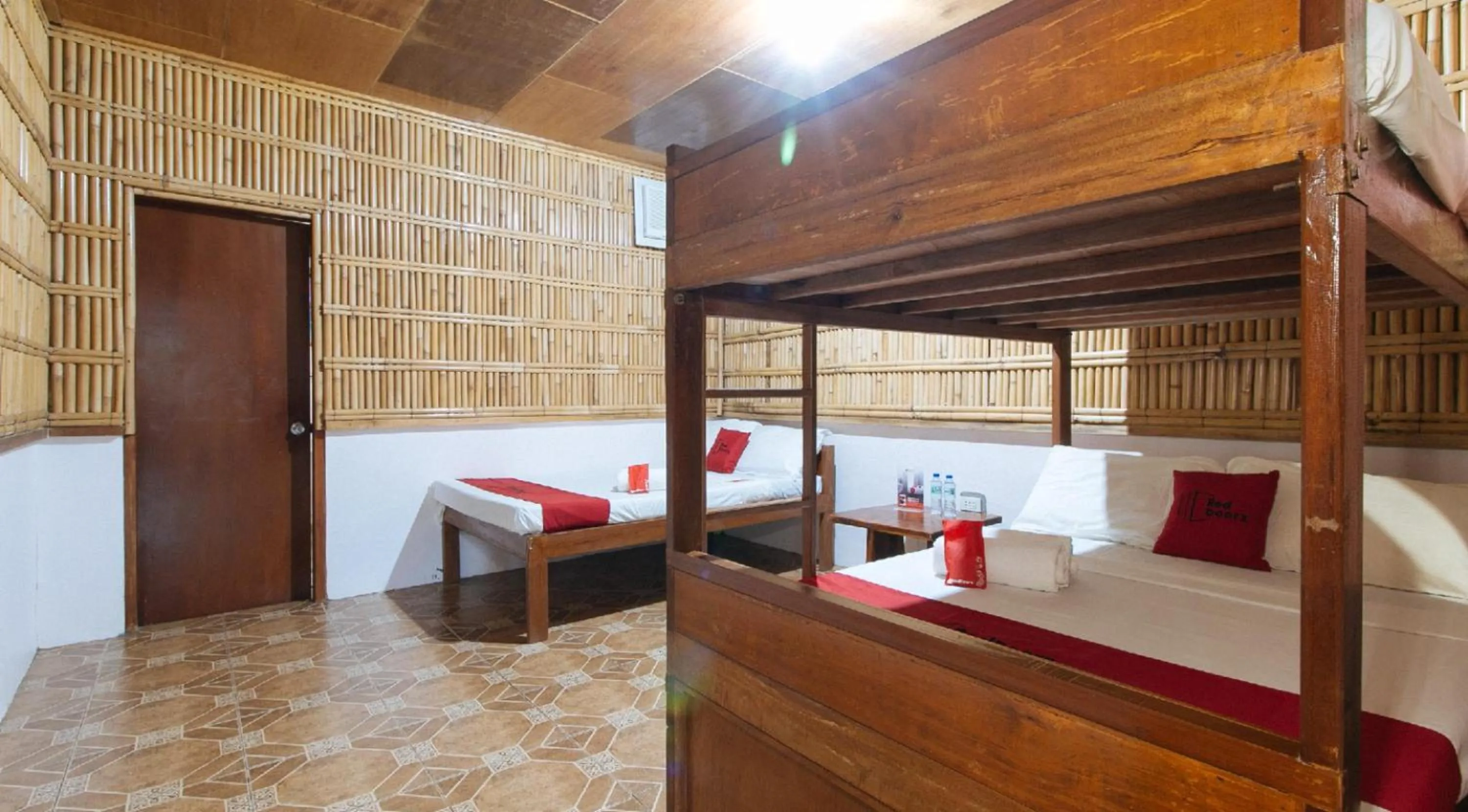 bunk bed, Bed in RedDoorz Hostel at Megans Paradisio Beach Resort