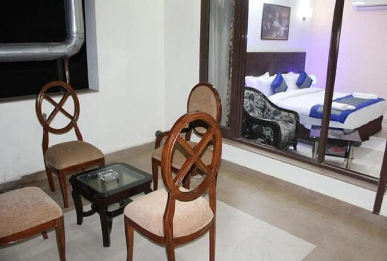 Seating area, Bed in Lime Tree Hotel Sushant Lok Gurgaon Sector 29 Next to IFFCO CHOWK metro