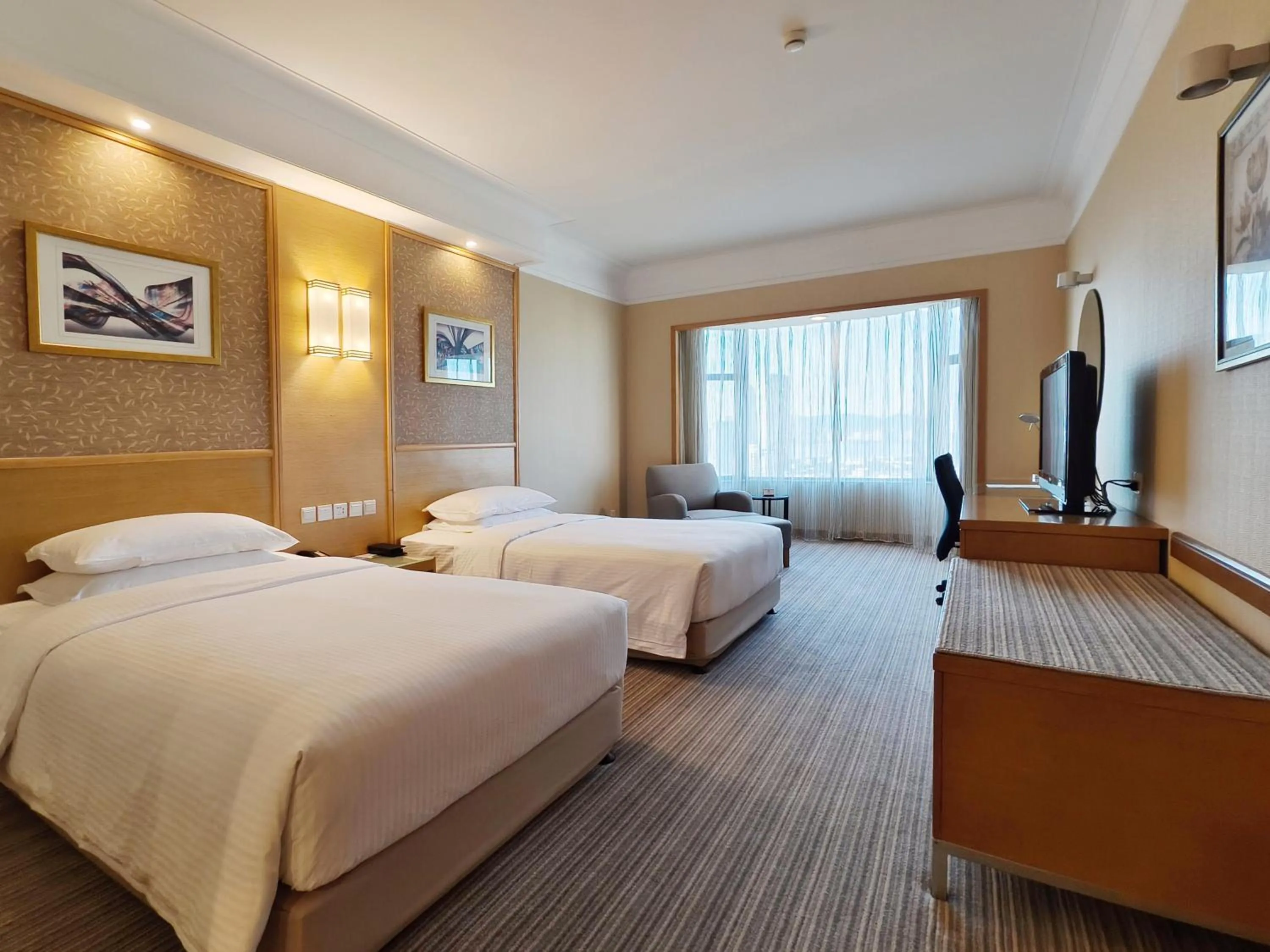 Photo of the whole room, Bed in Millennium Harbourview Hotel Xiamen