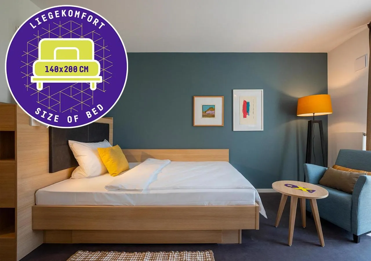 Bed in KONCEPT HOTEL Neue Horizonte