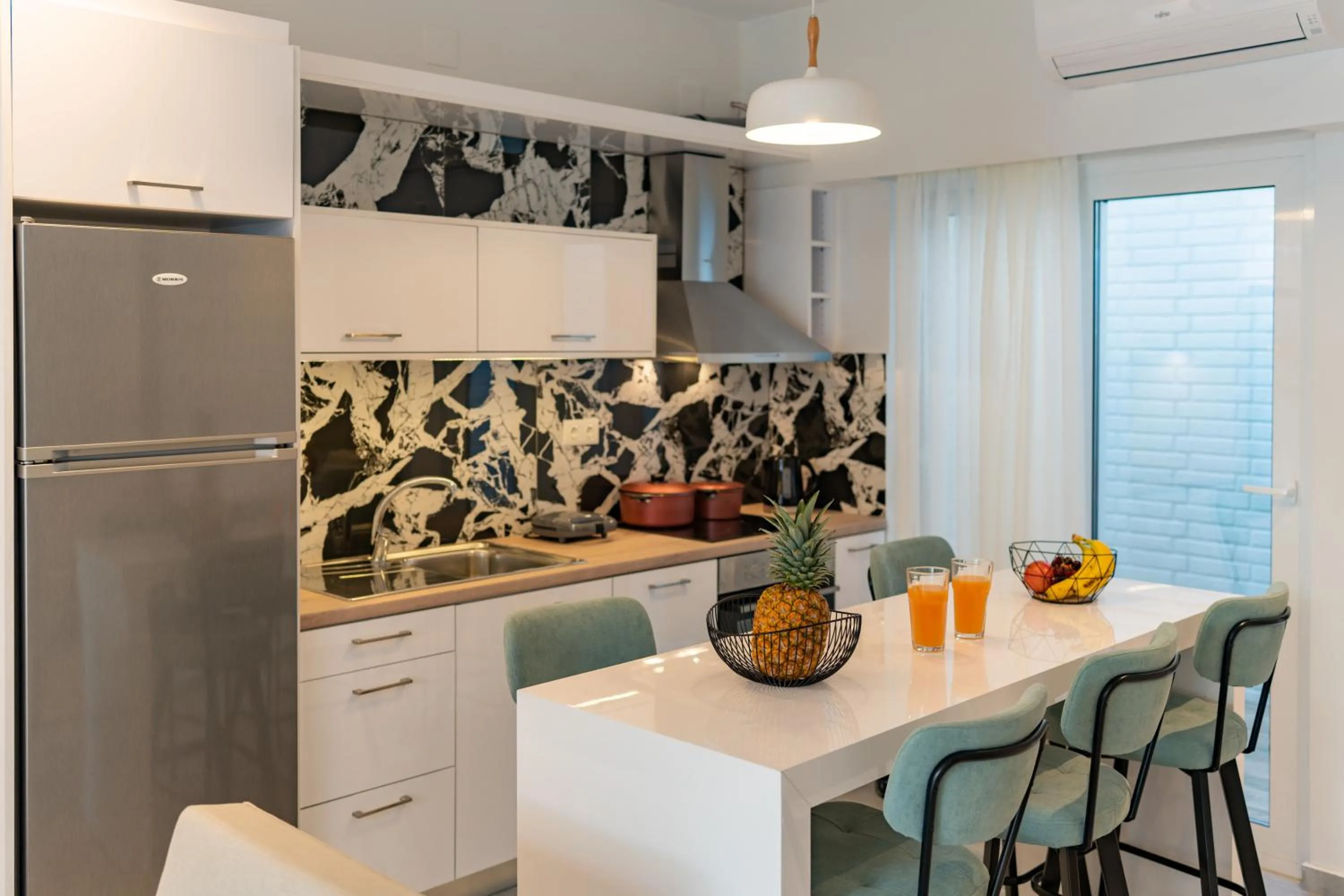 Kitchen or kitchenette in City and Sand Suites