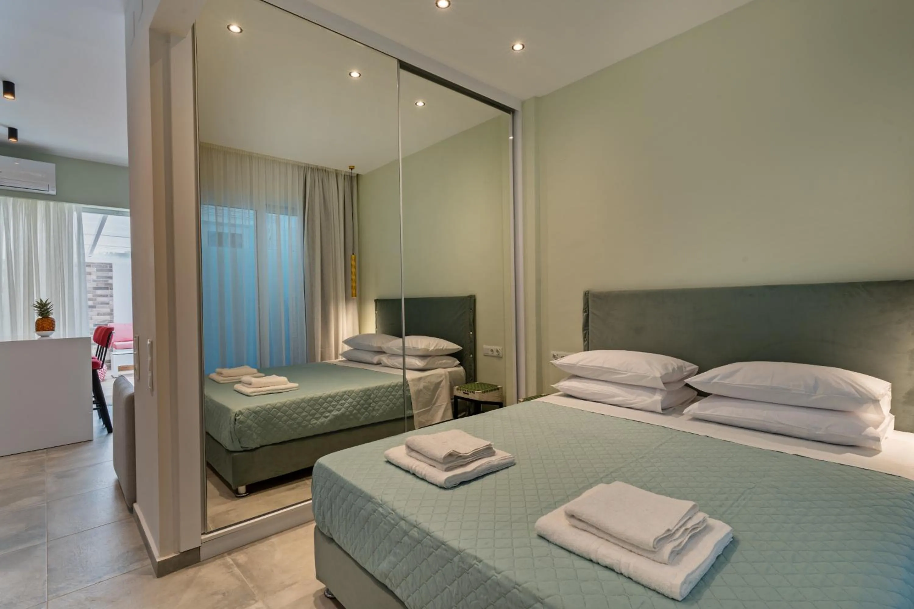 Bed in City and Sand Suites