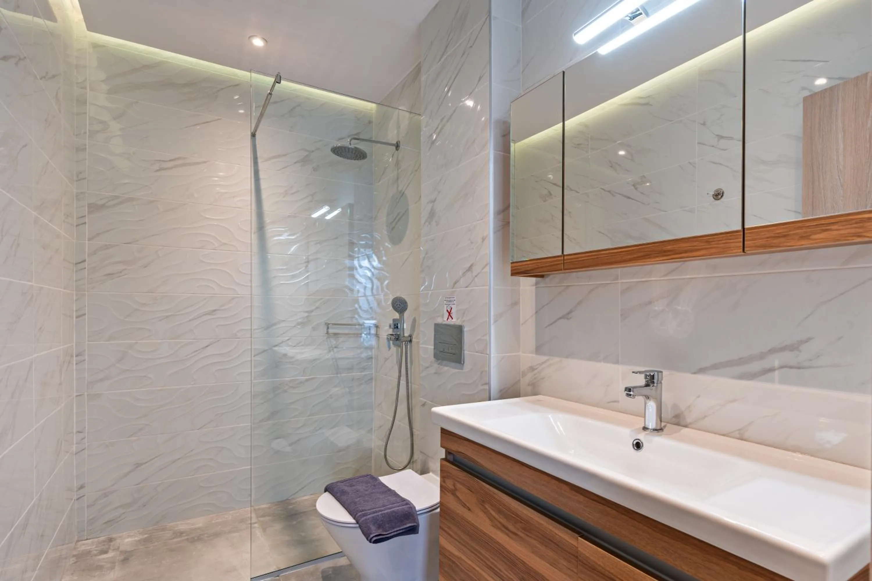Bathroom in City and Sand Suites