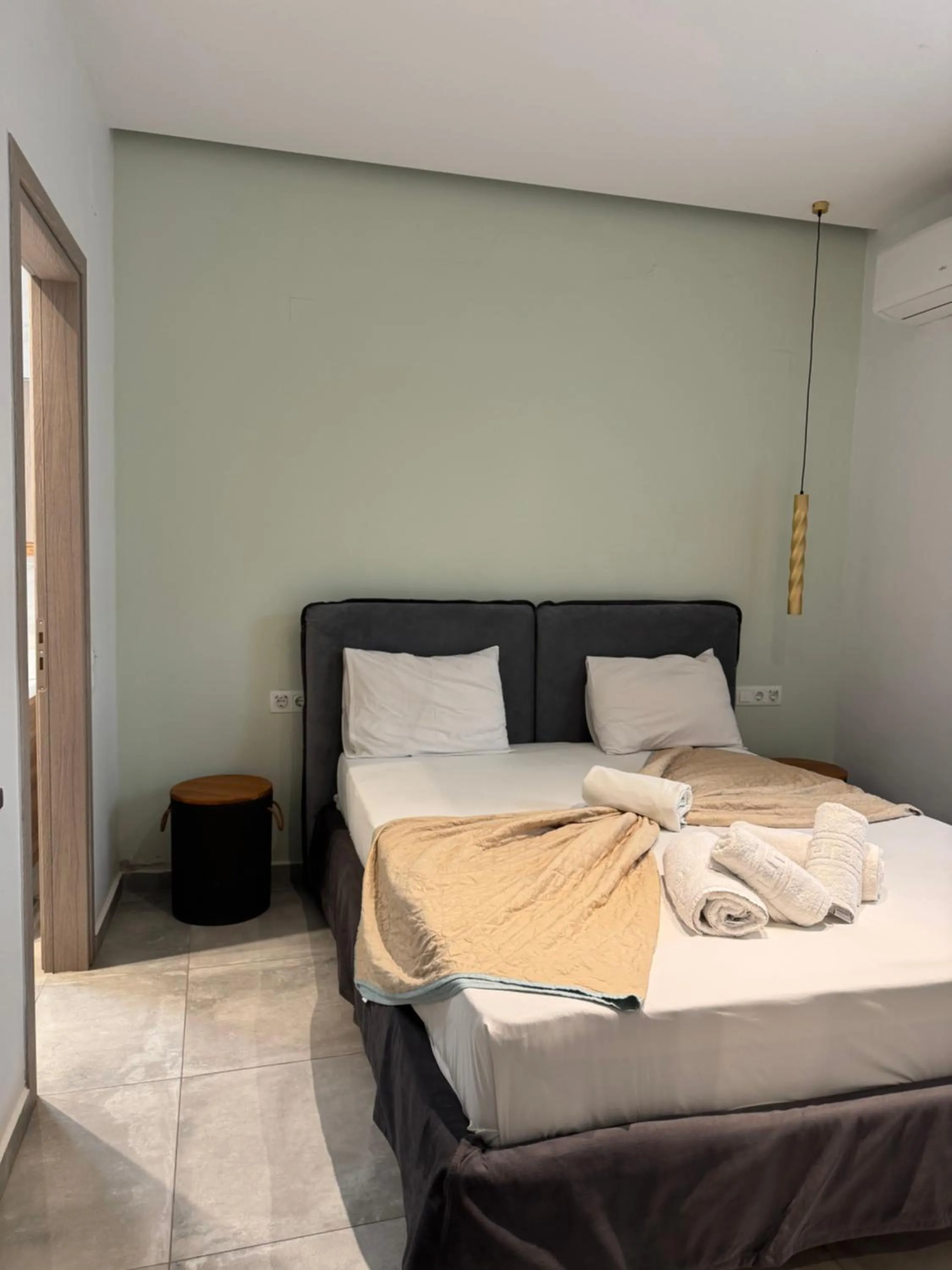 Bed in City and Sand Suites