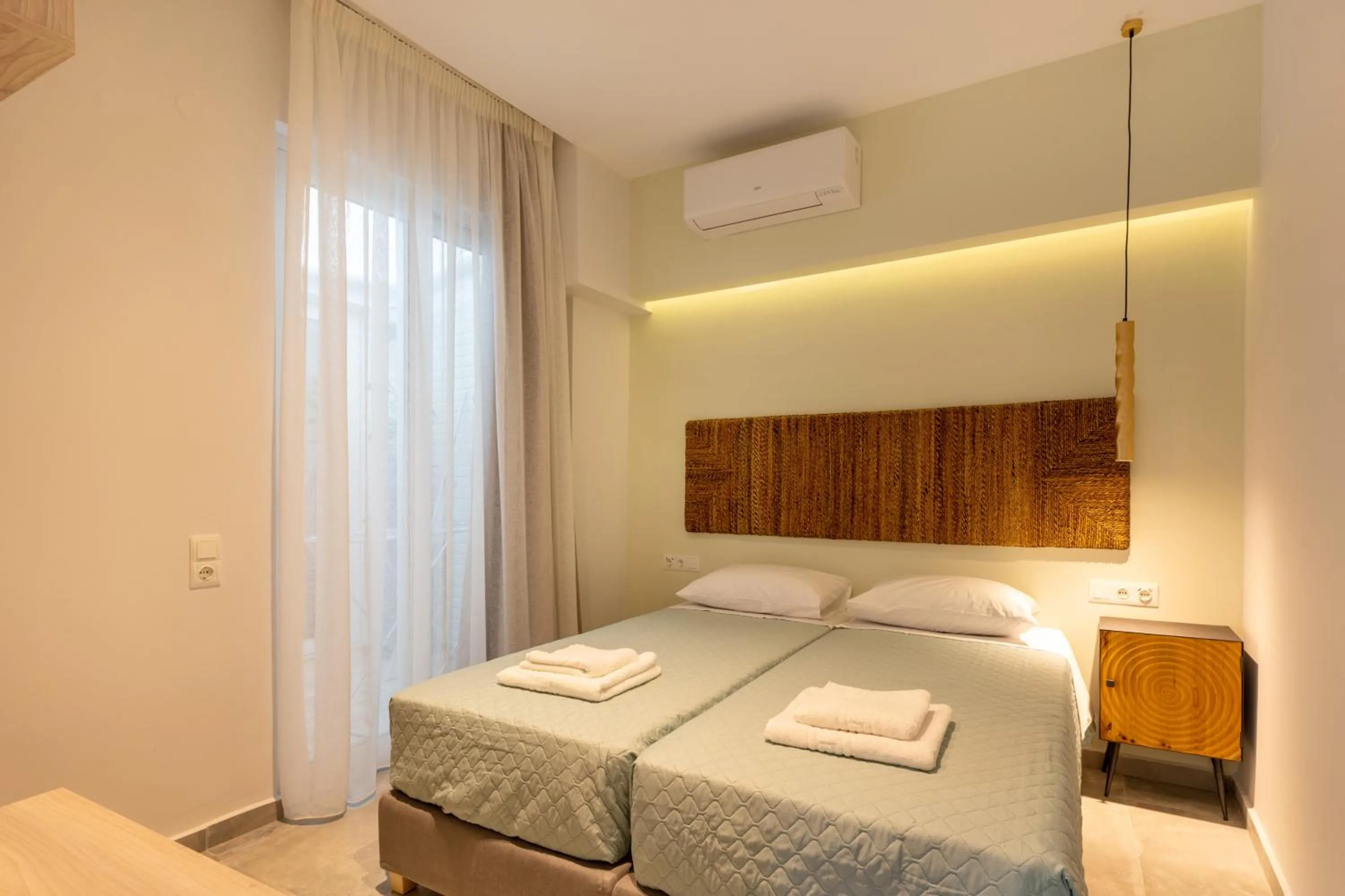 Bed in City and Sand Suites