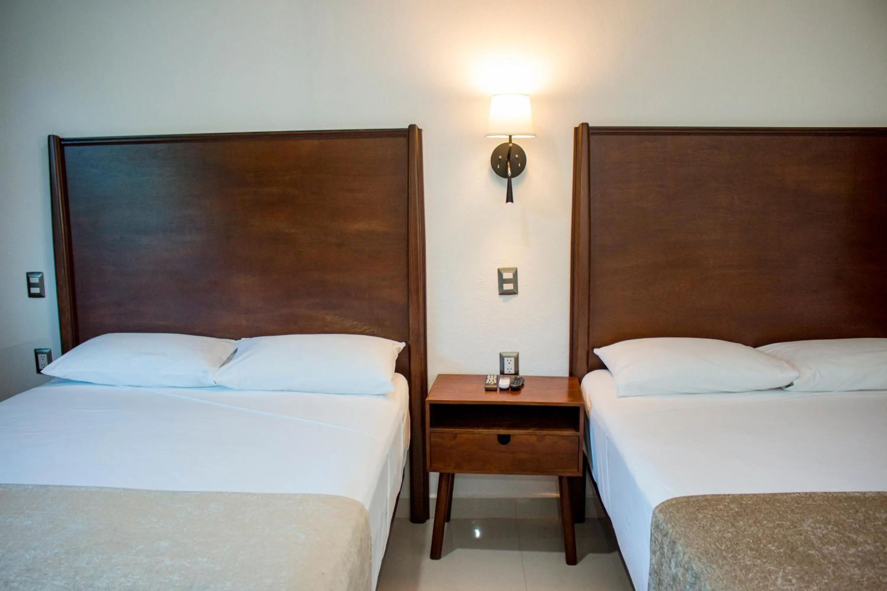 Bed in LA LOMA SUITES