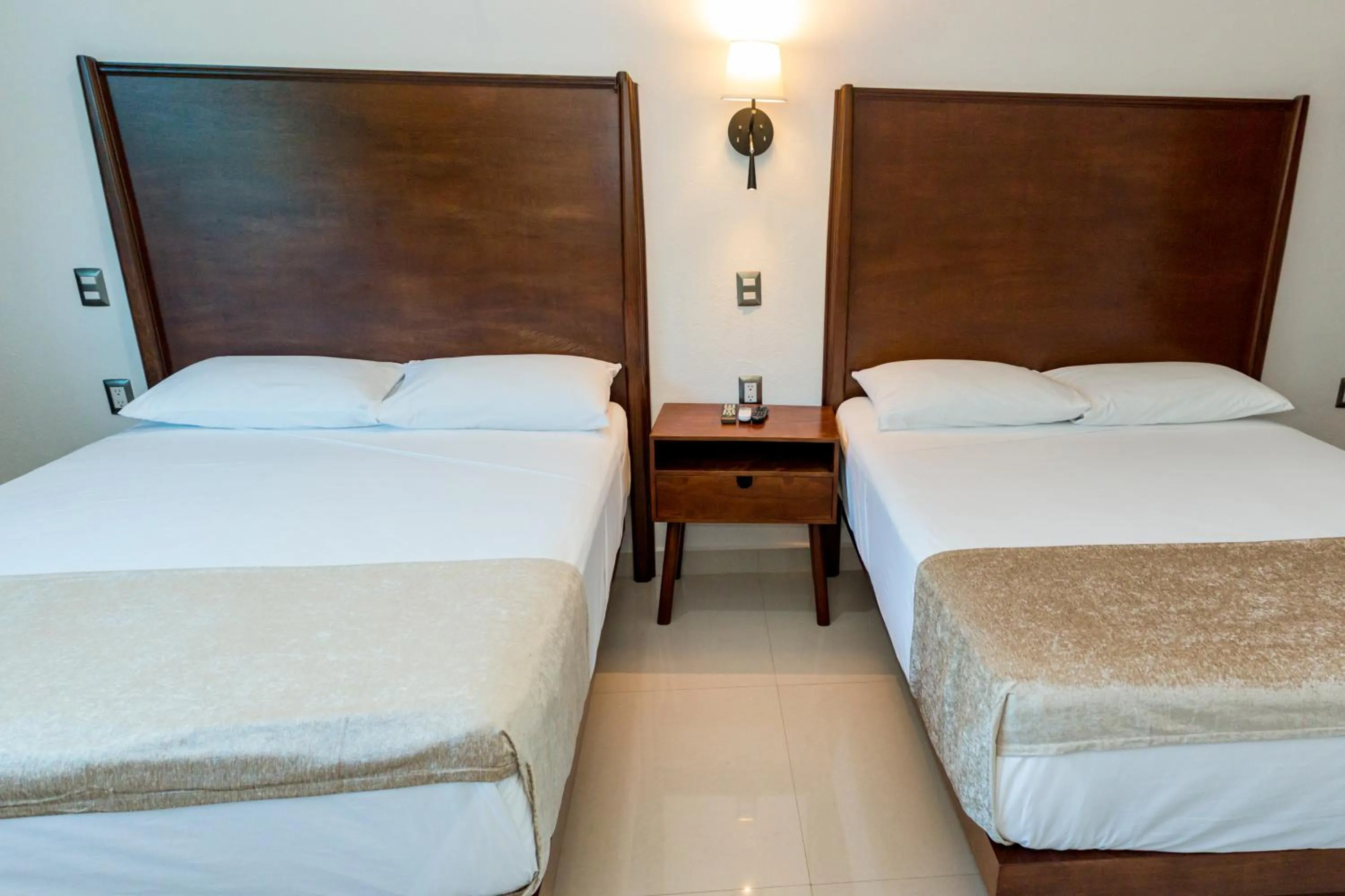 Bed in LA LOMA SUITES