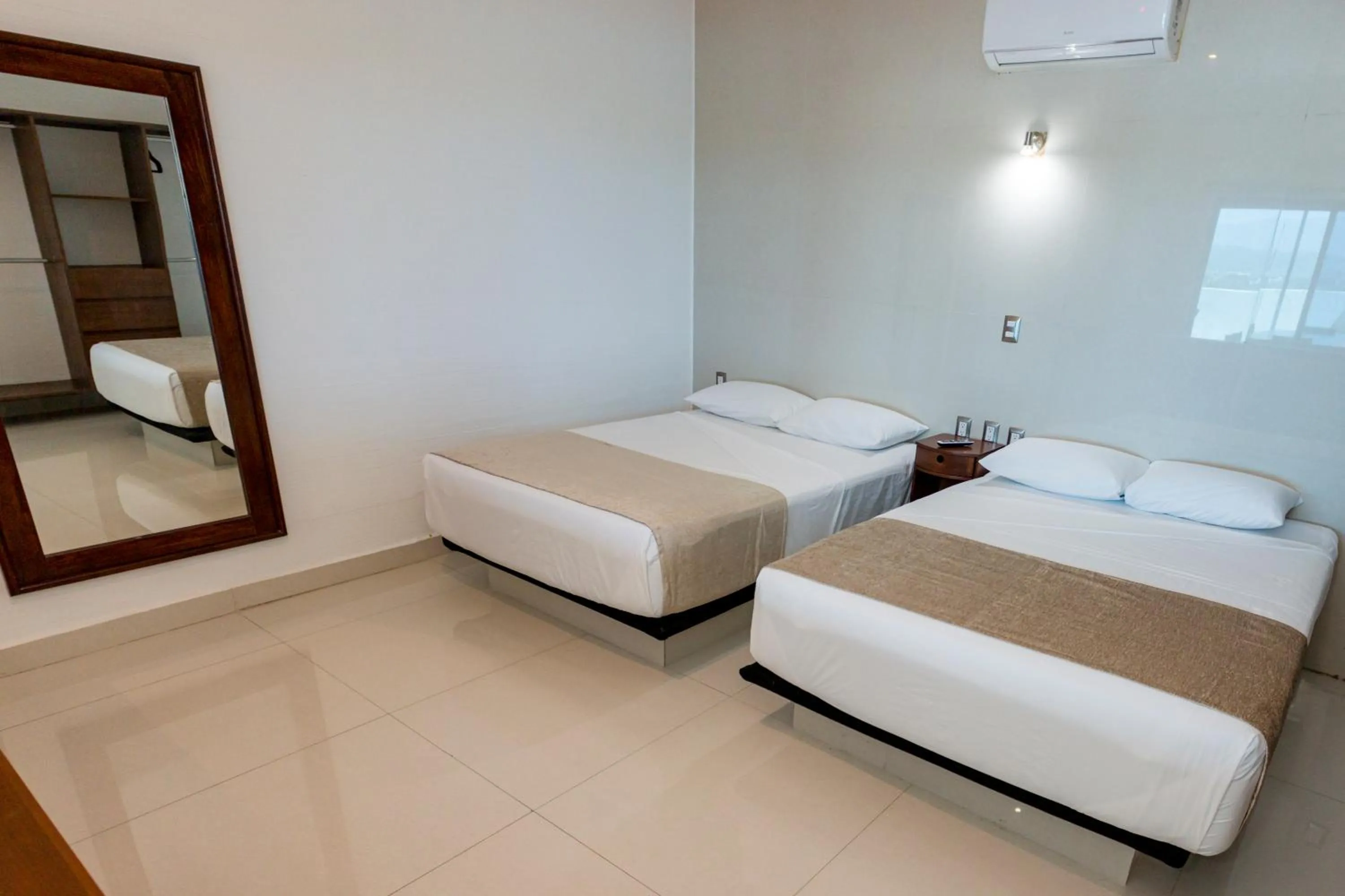 Bed in LA LOMA SUITES