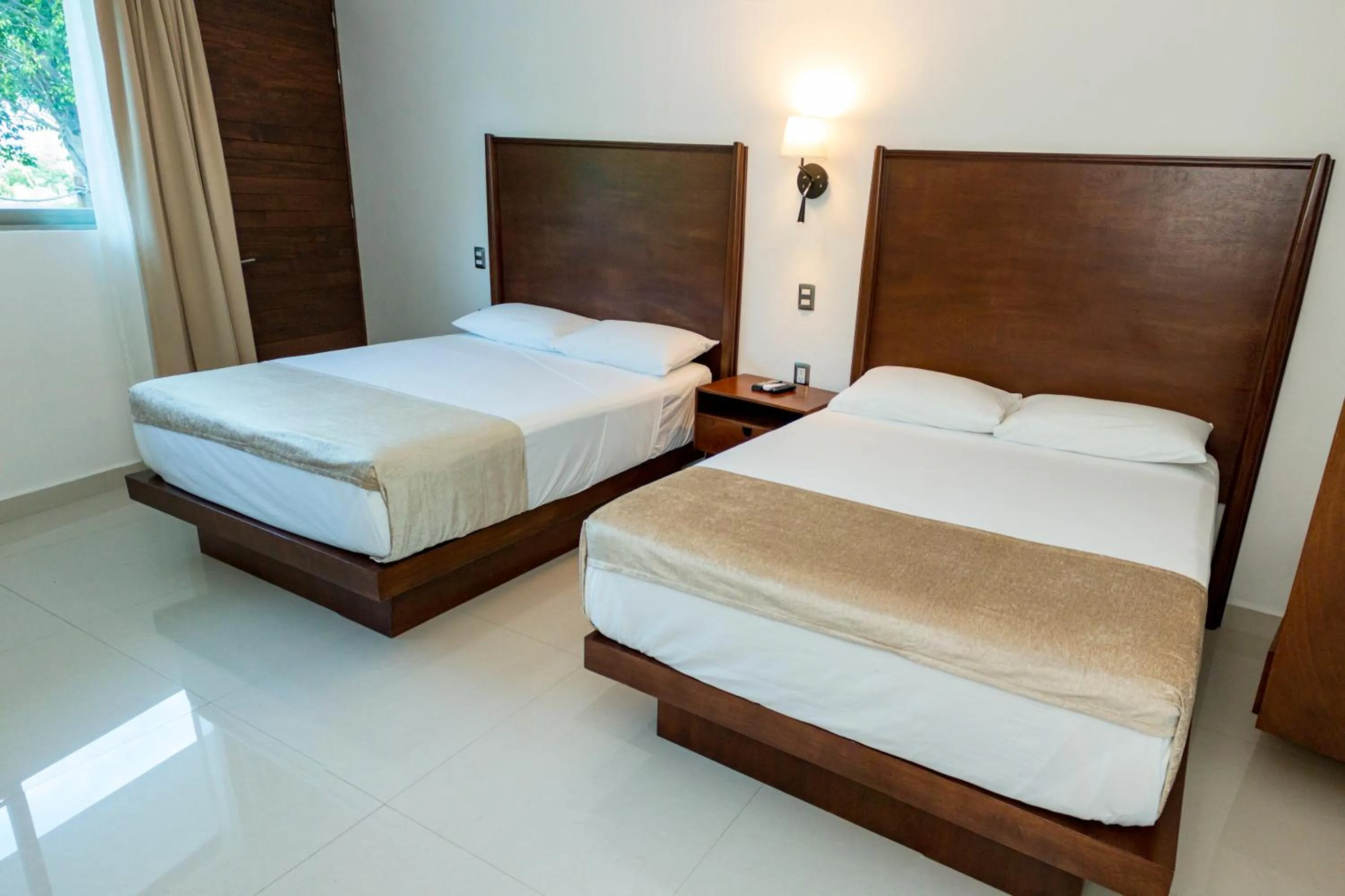 Bed in LA LOMA SUITES
