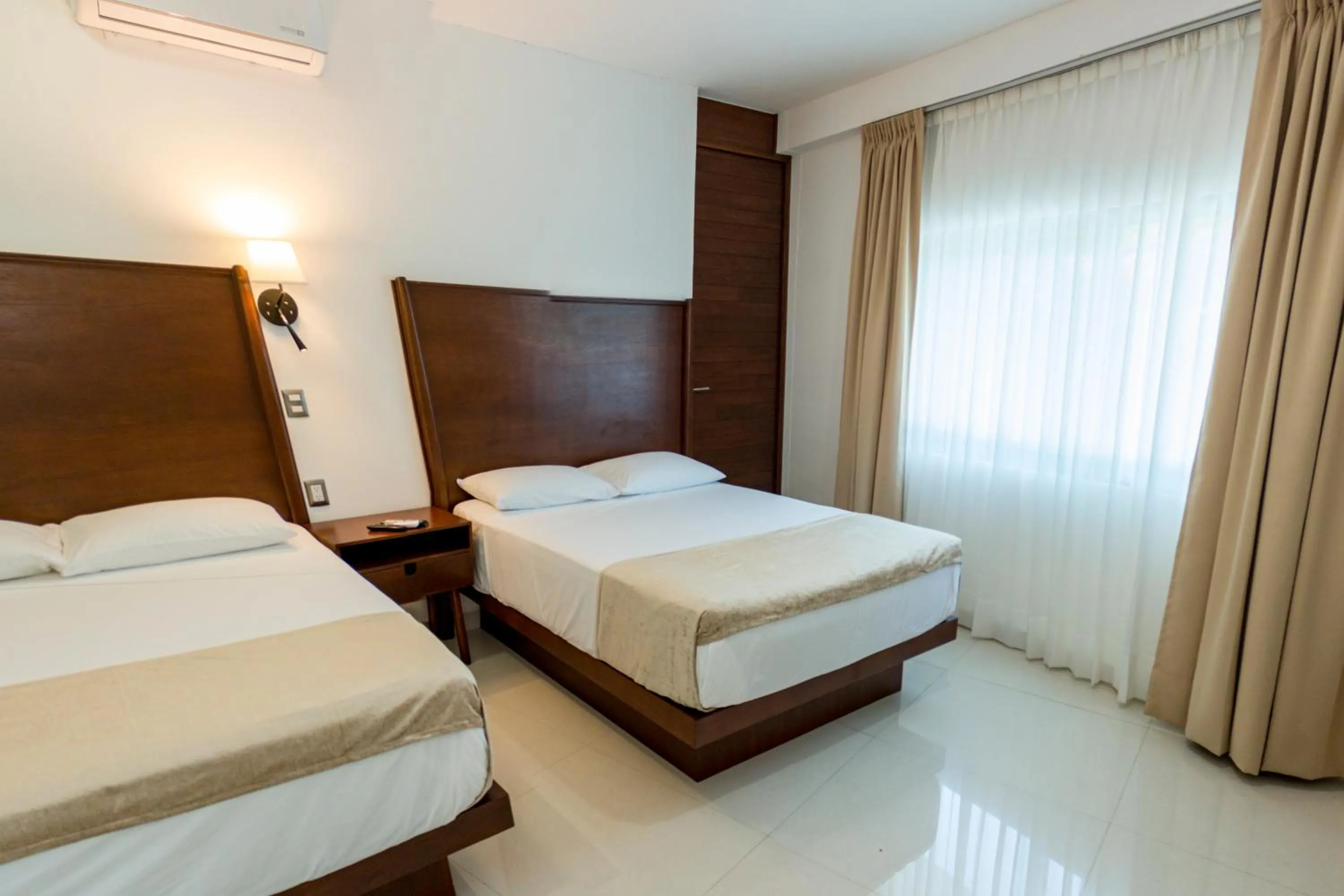 Bed in LA LOMA SUITES