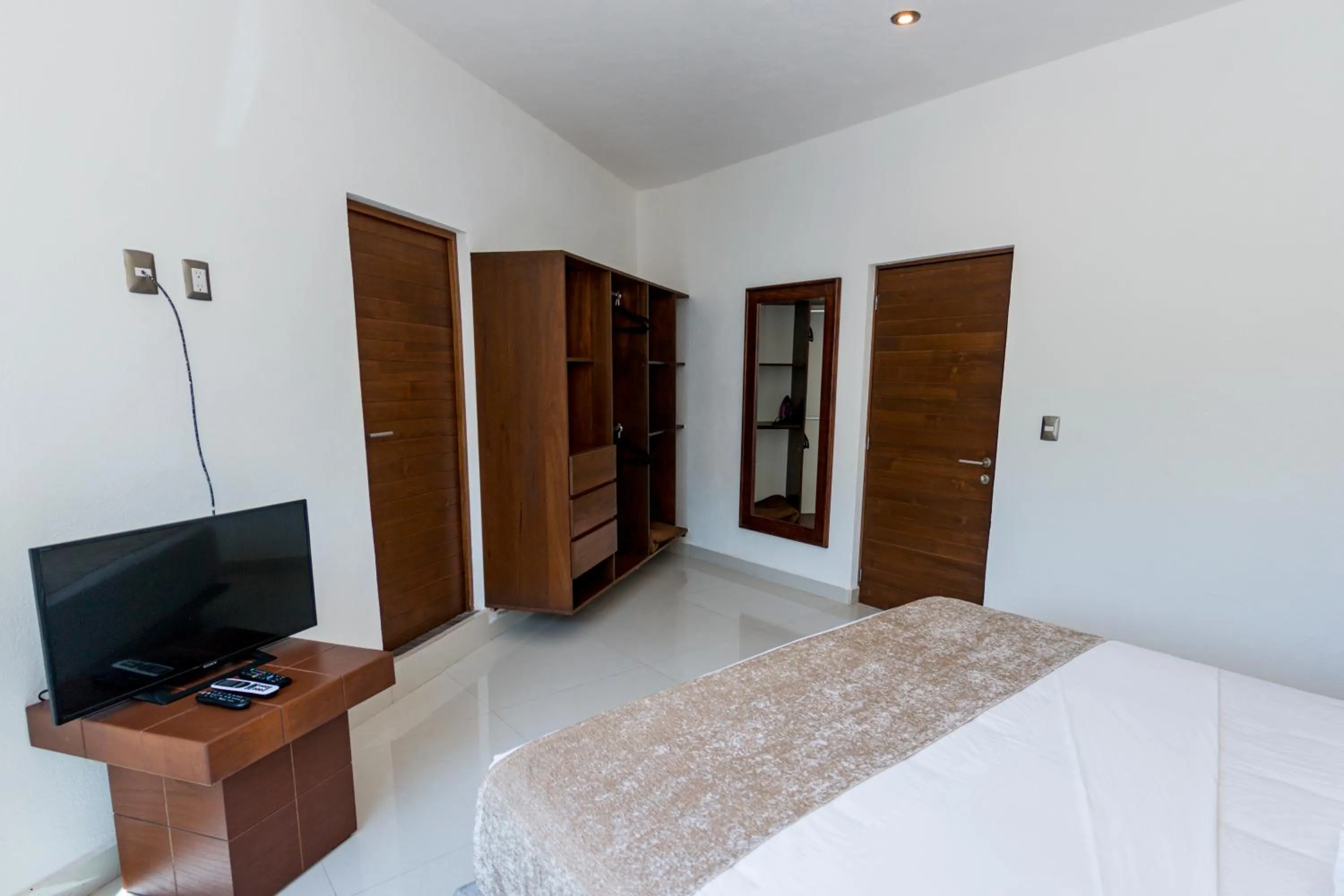 Bed in LA LOMA SUITES