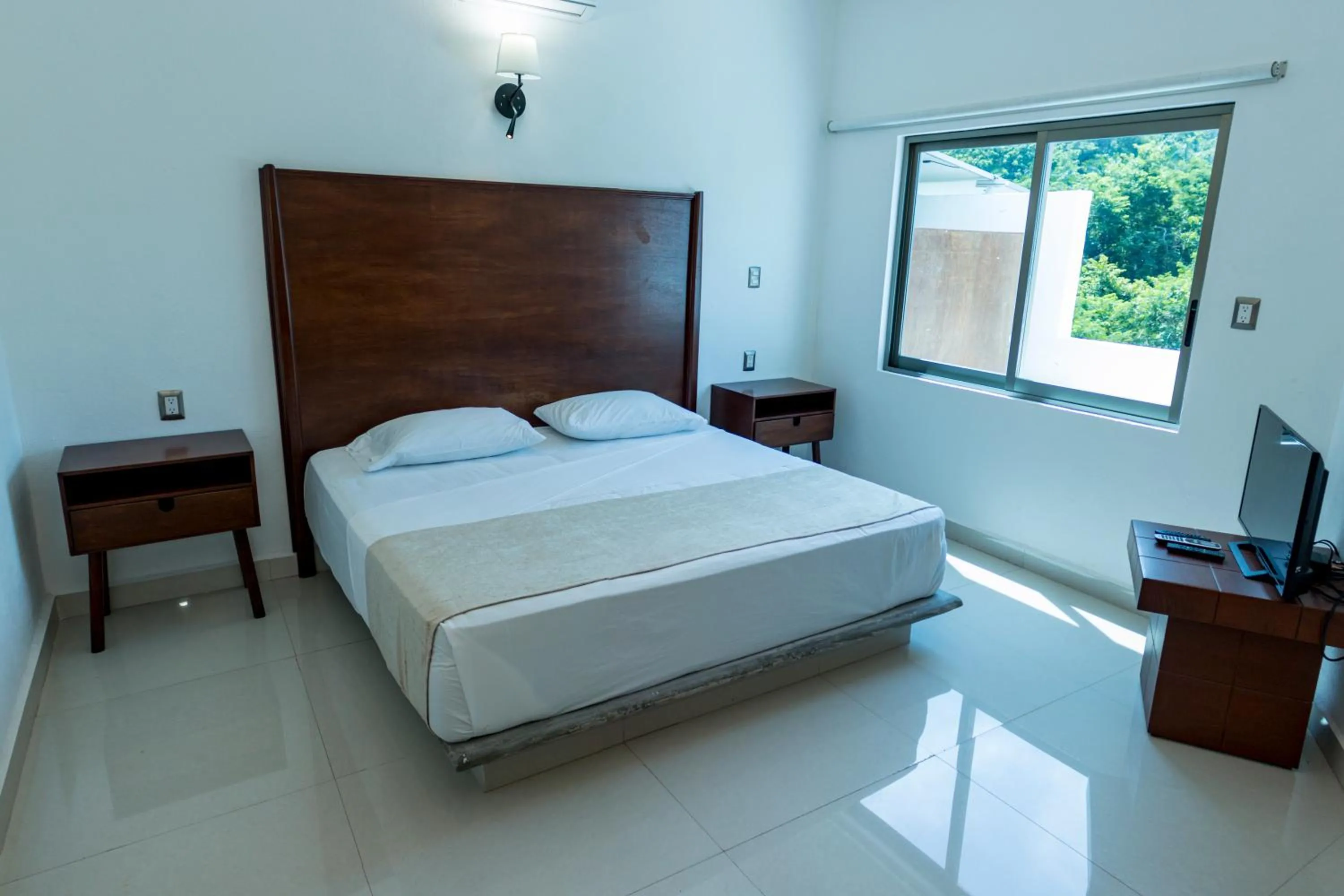 Bed in LA LOMA SUITES