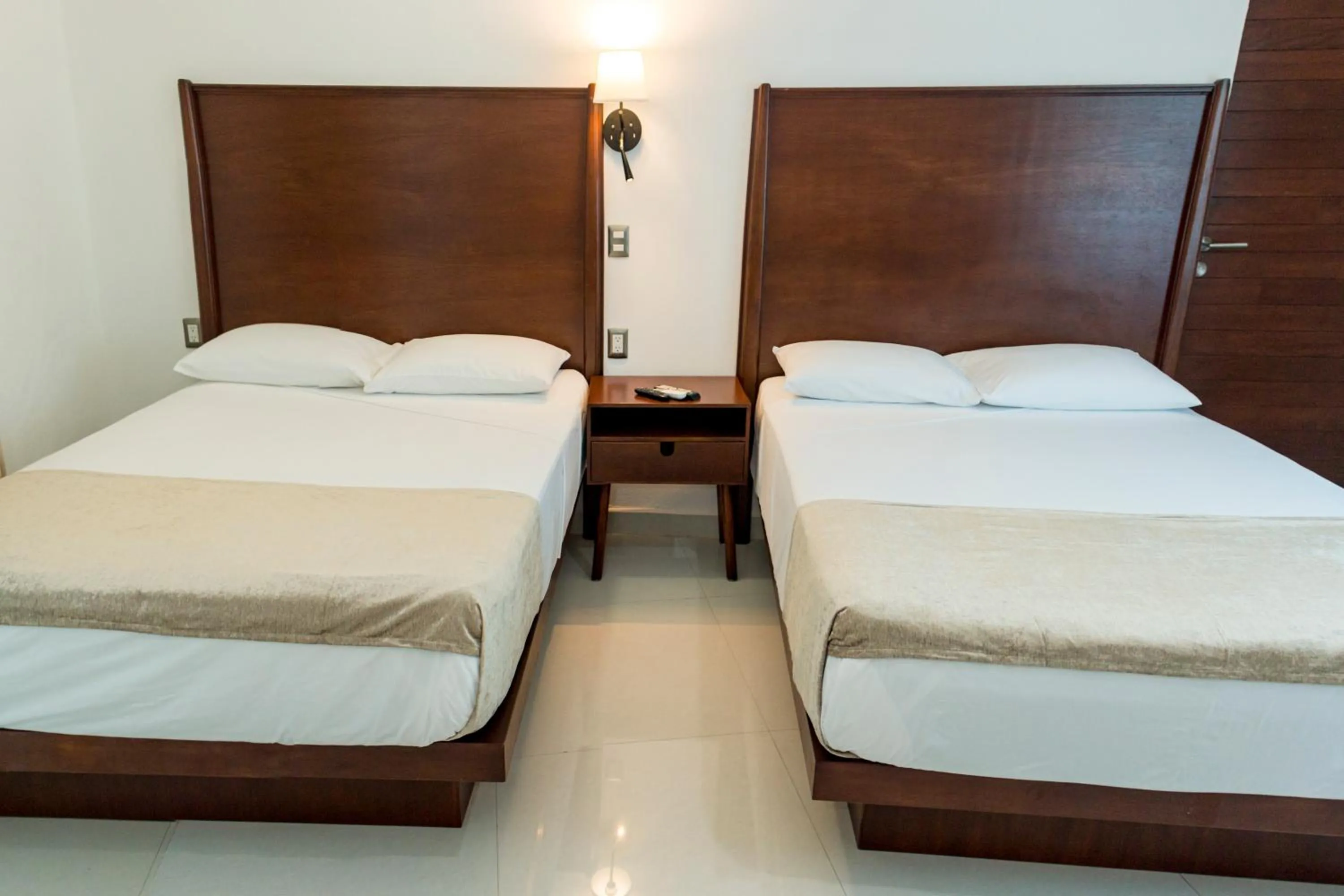 Bed in LA LOMA SUITES