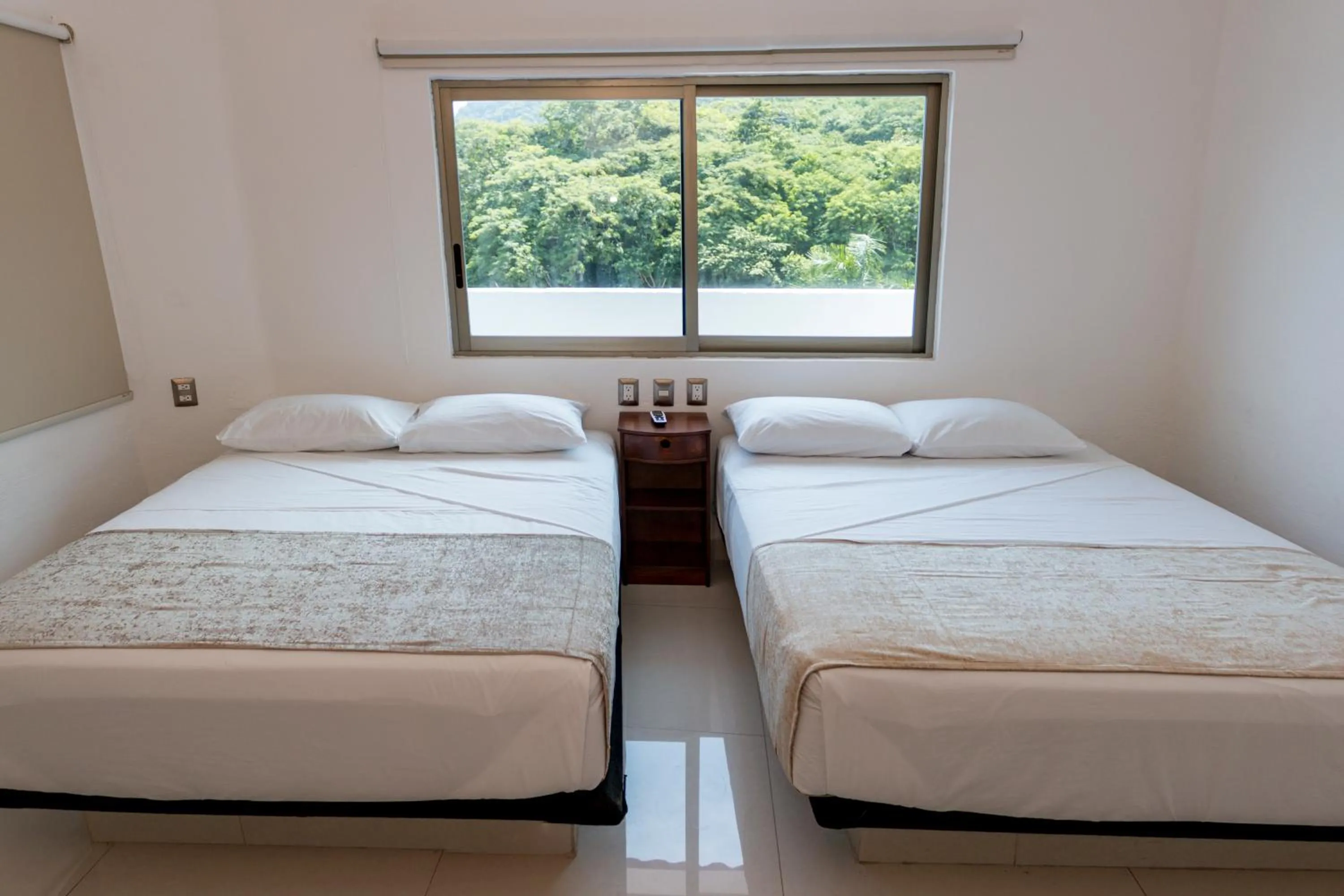 Bed in LA LOMA SUITES