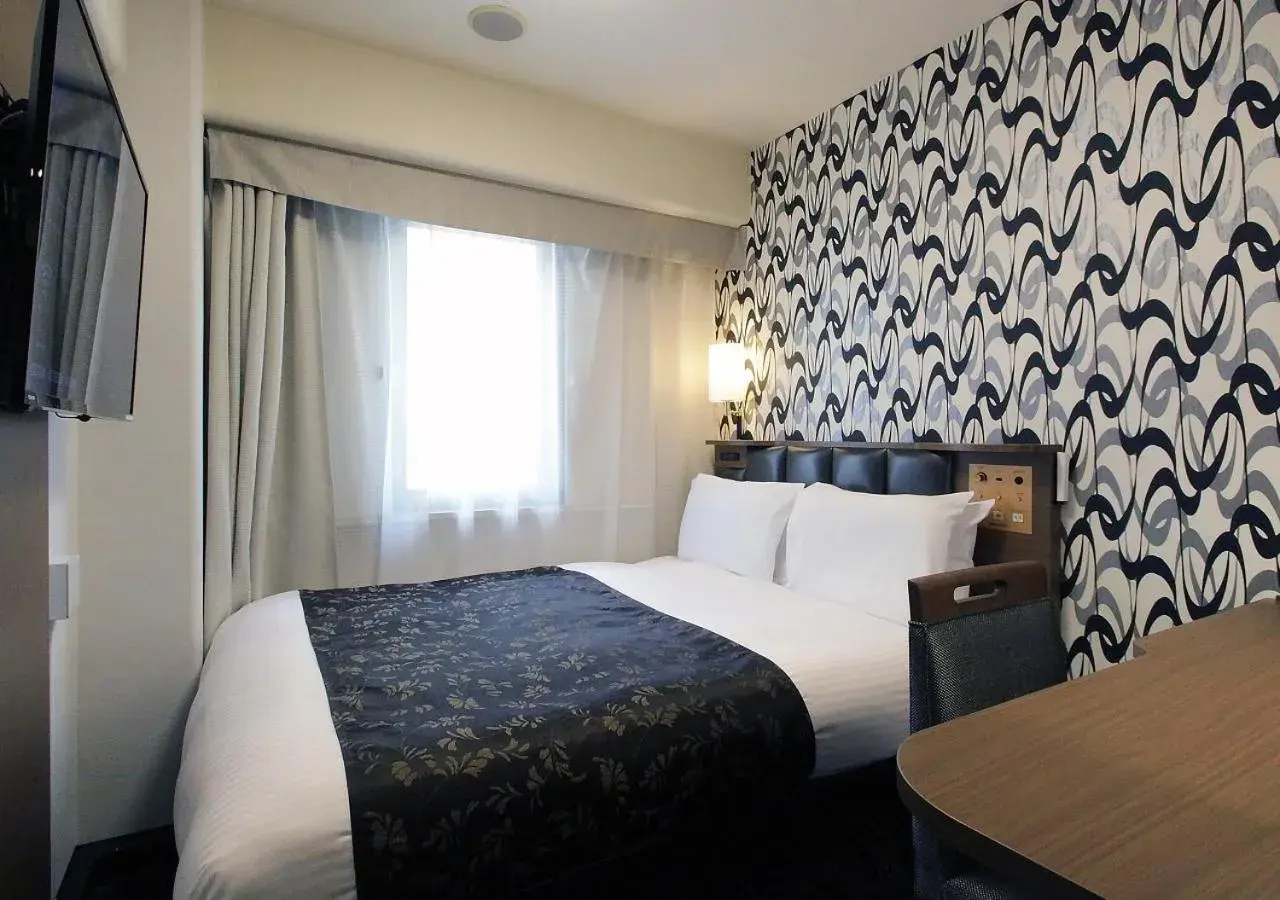 Bed in APA Hotel Nambakita Shinsaibashi Ekimae Bed in APA Hotel Nambakita Shinsaibashi Ekimae