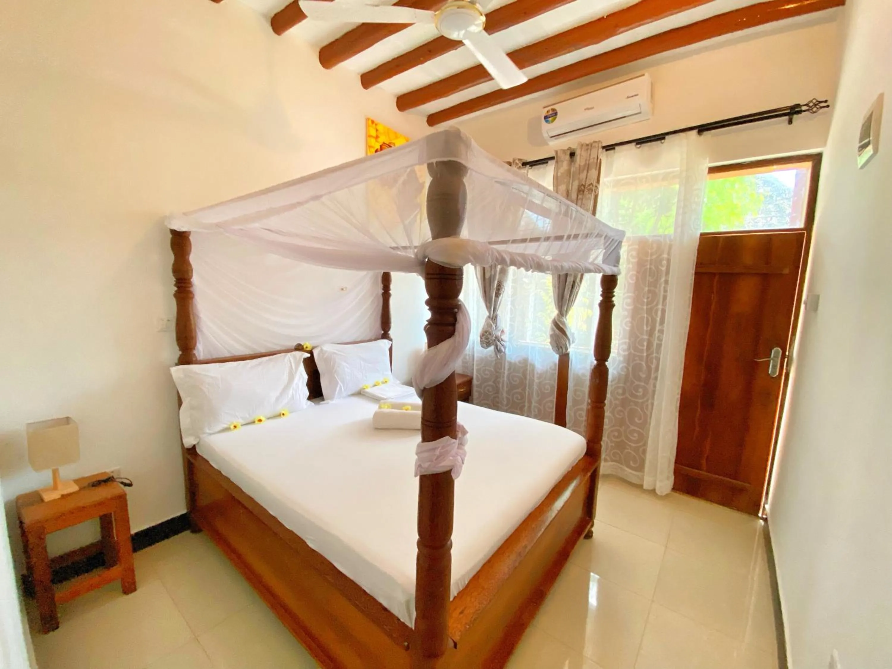 Bed in Utulivu Bungalow