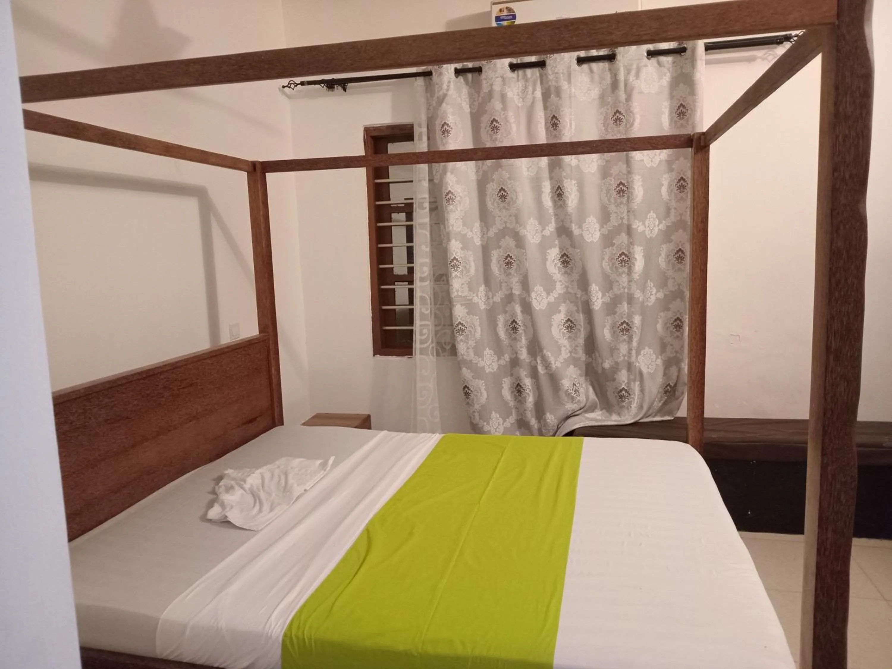 Bed in Utulivu Bungalow