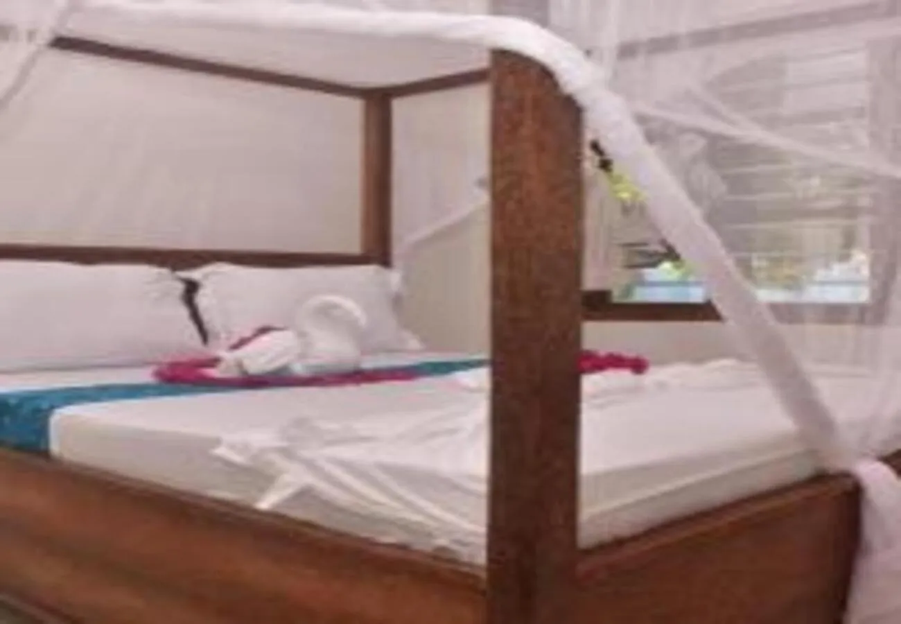 Bed in Utulivu Bungalow