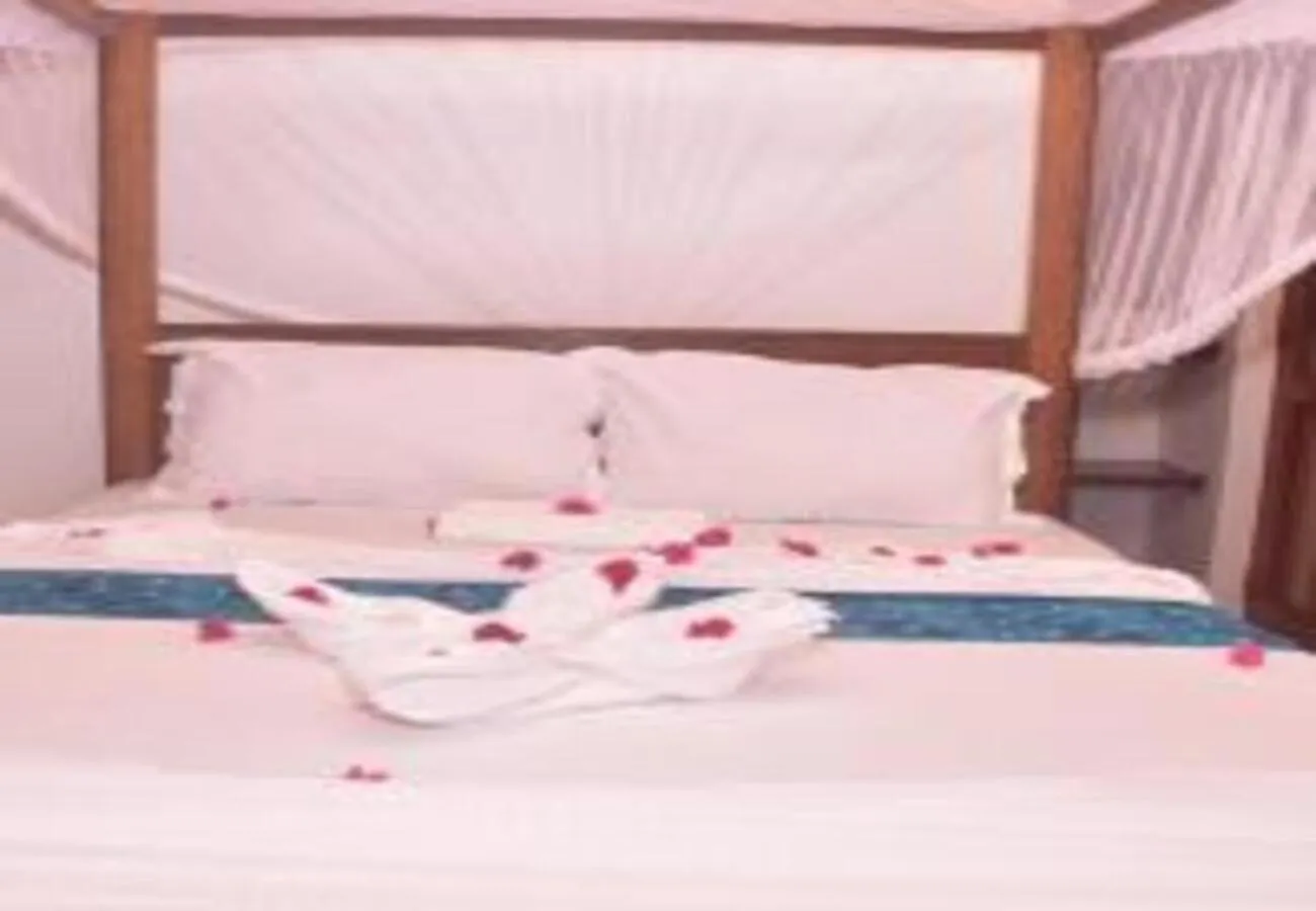 Bed in Utulivu Bungalow