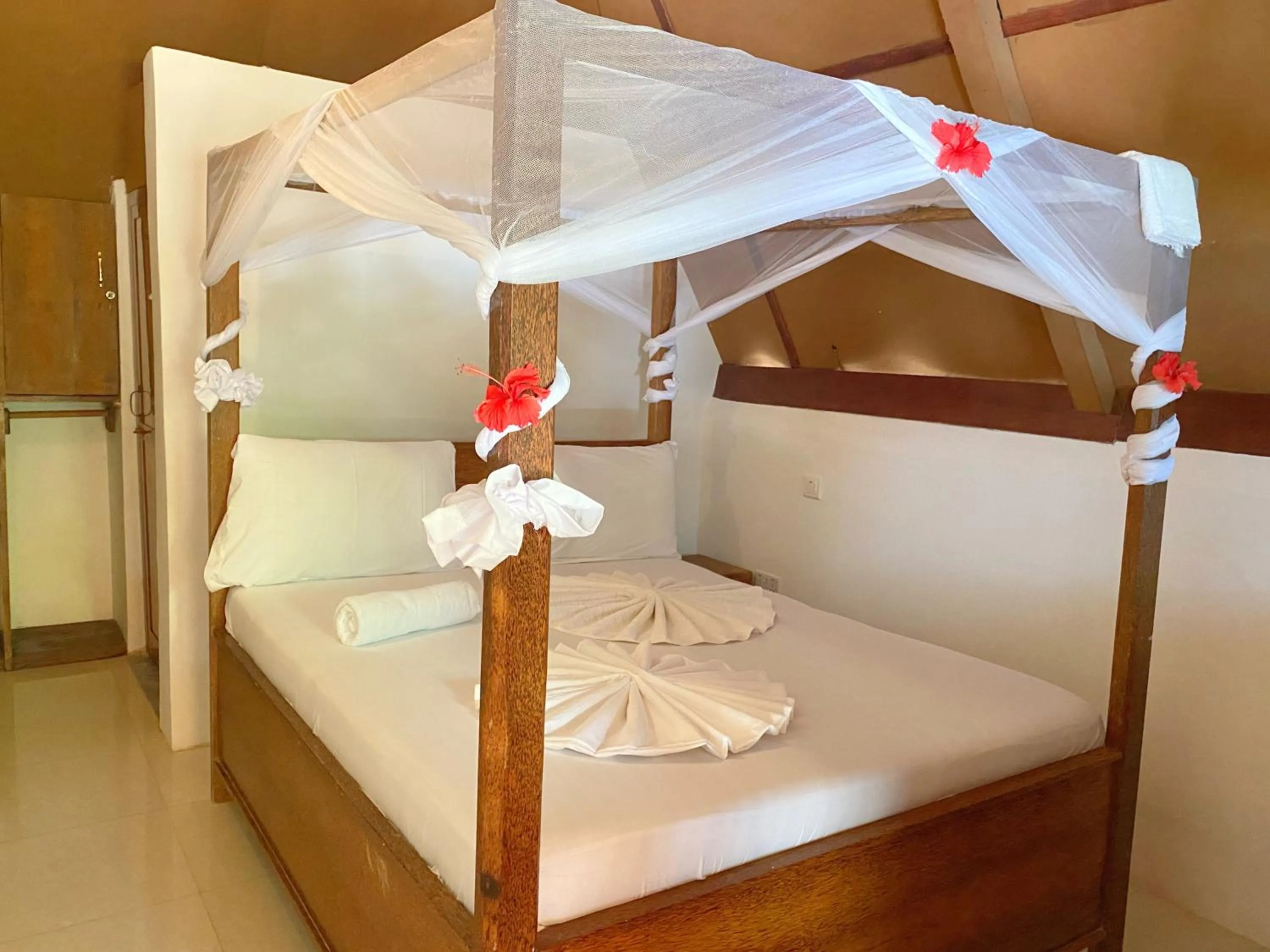 Bed in Utulivu Bungalow