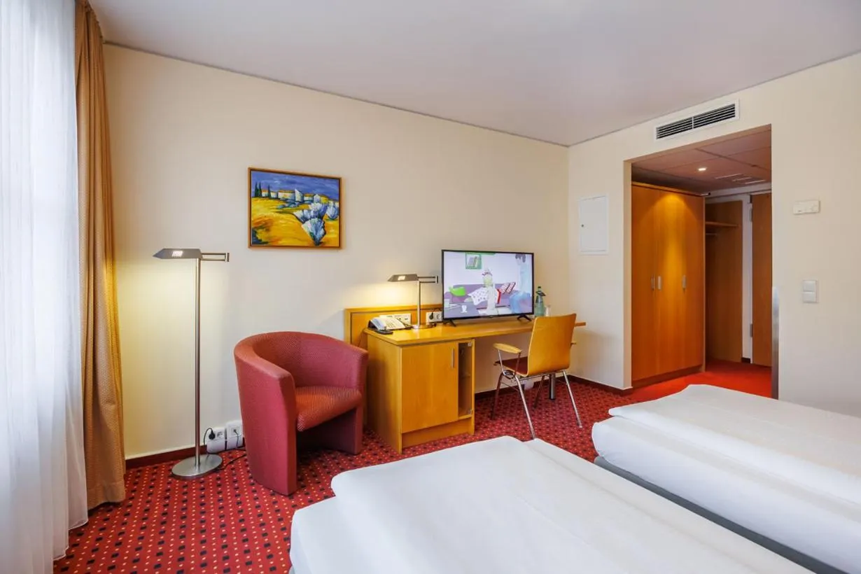 Photo of the whole room, Bed in Airporthotel Berlin-Adlershof