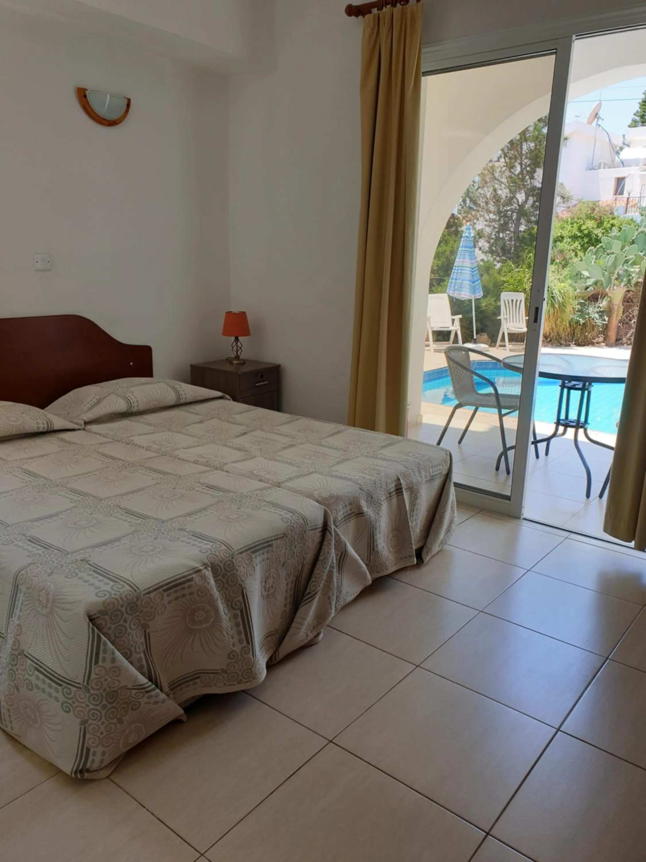 Bed in Arilena Holiday Apartments