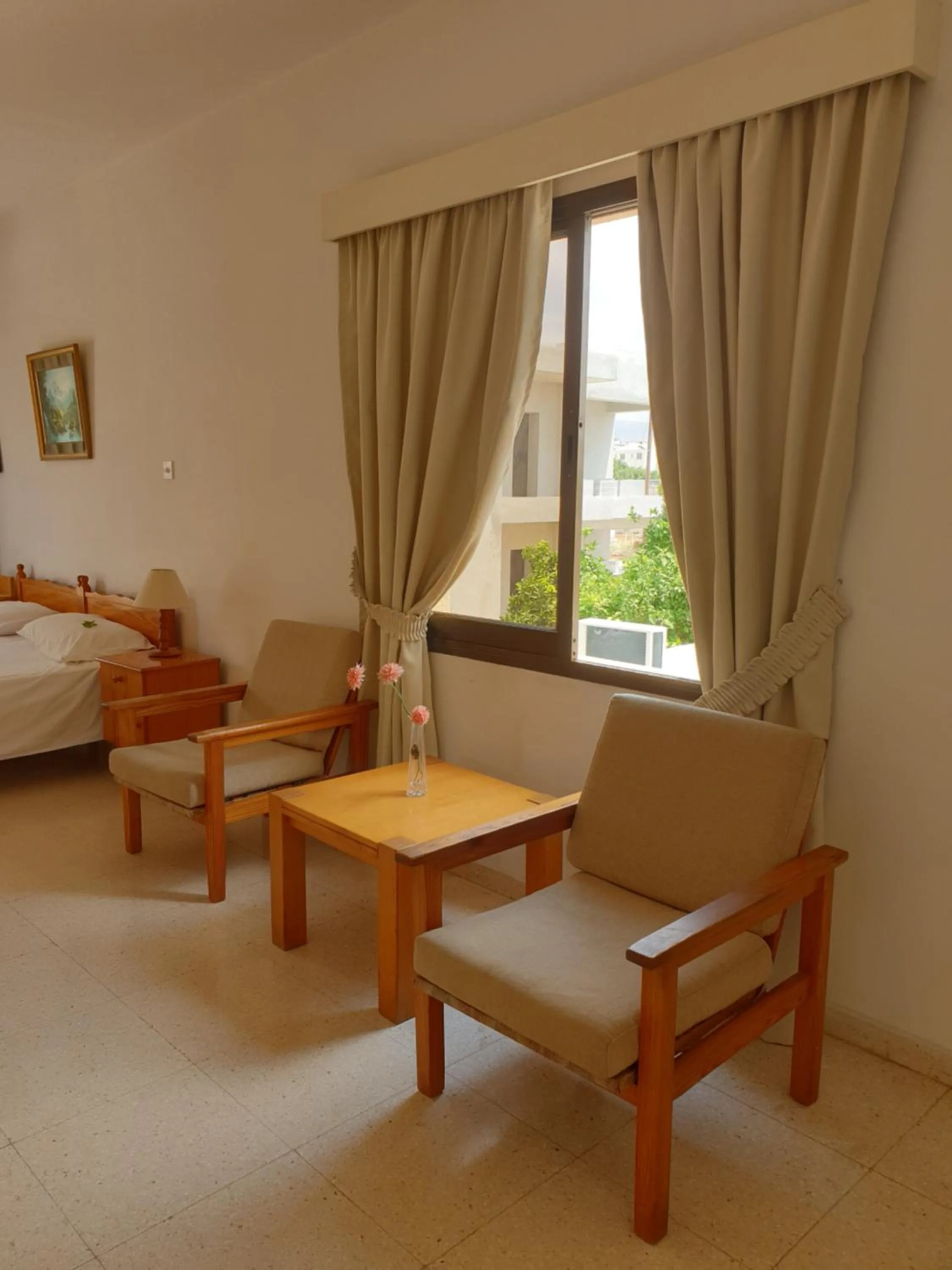 Seating area, Bed in Arilena Holiday Apartments