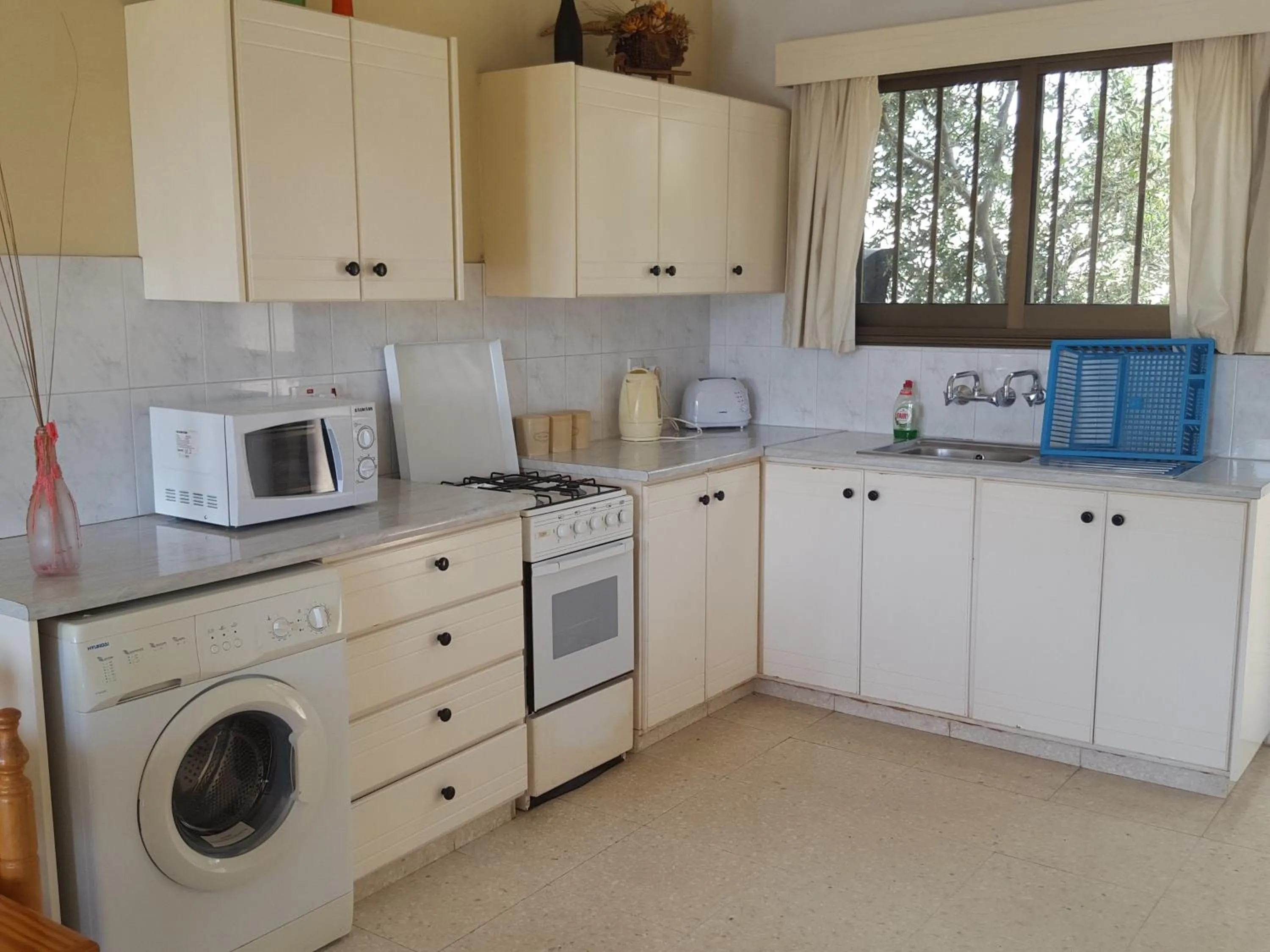 Kitchen or kitchenette in Arilena Holiday Apartments