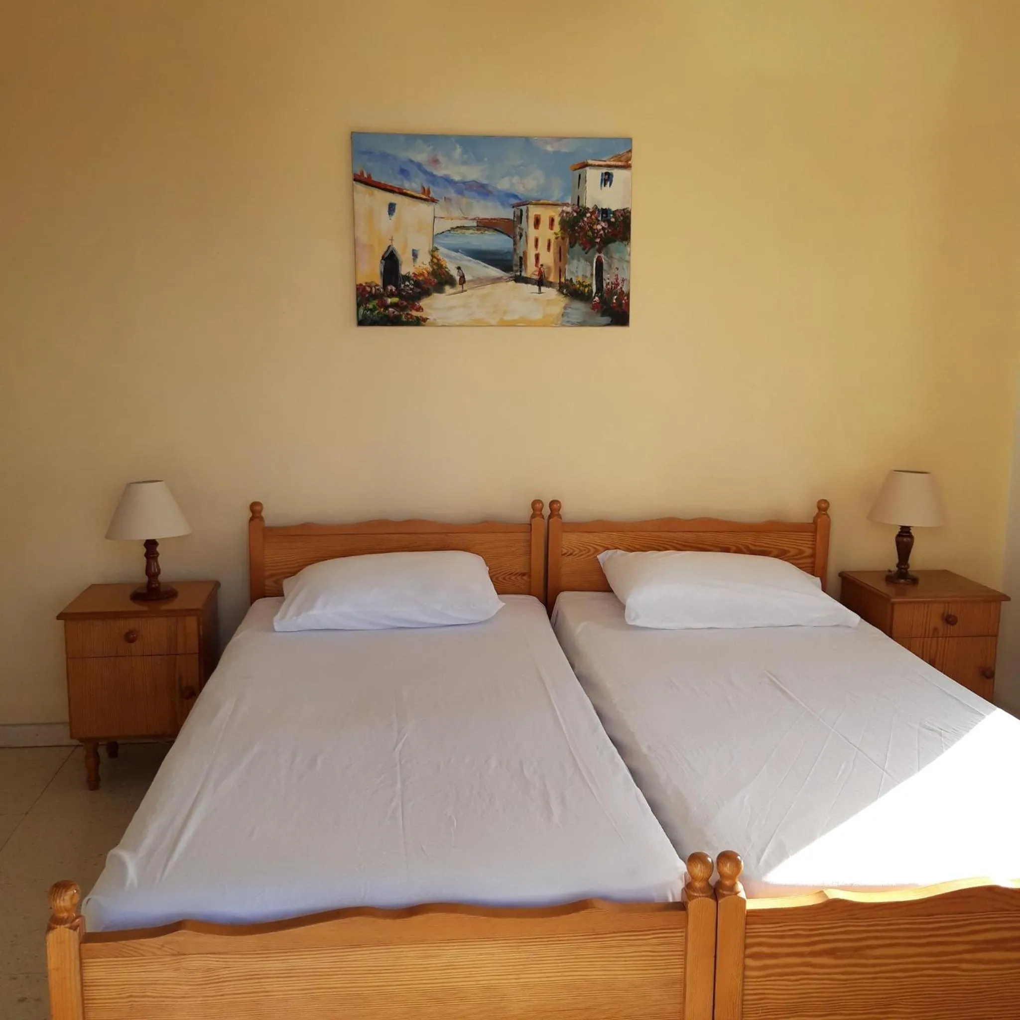 Bed in Arilena Holiday Apartments