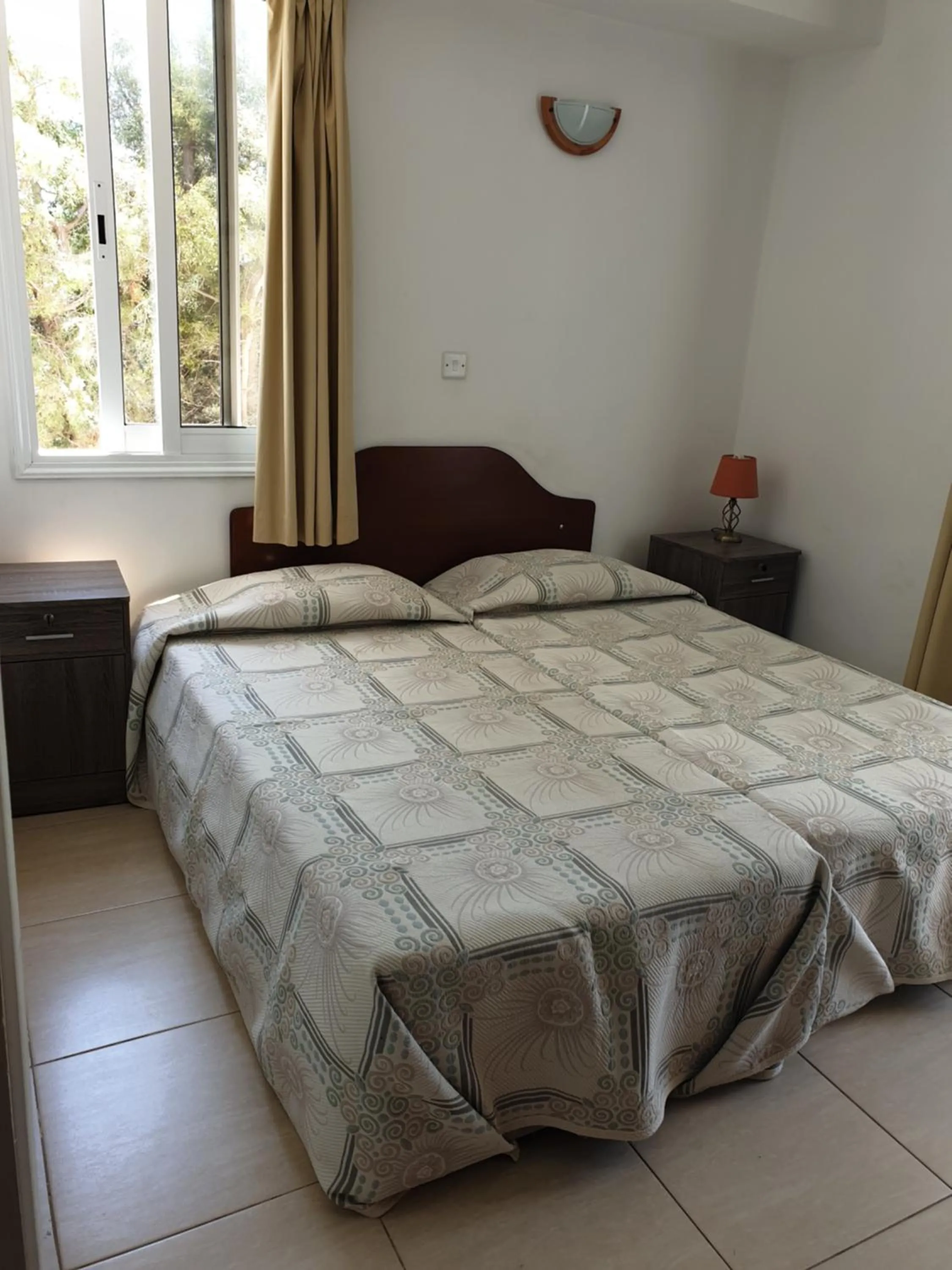 Bed in Arilena Holiday Apartments