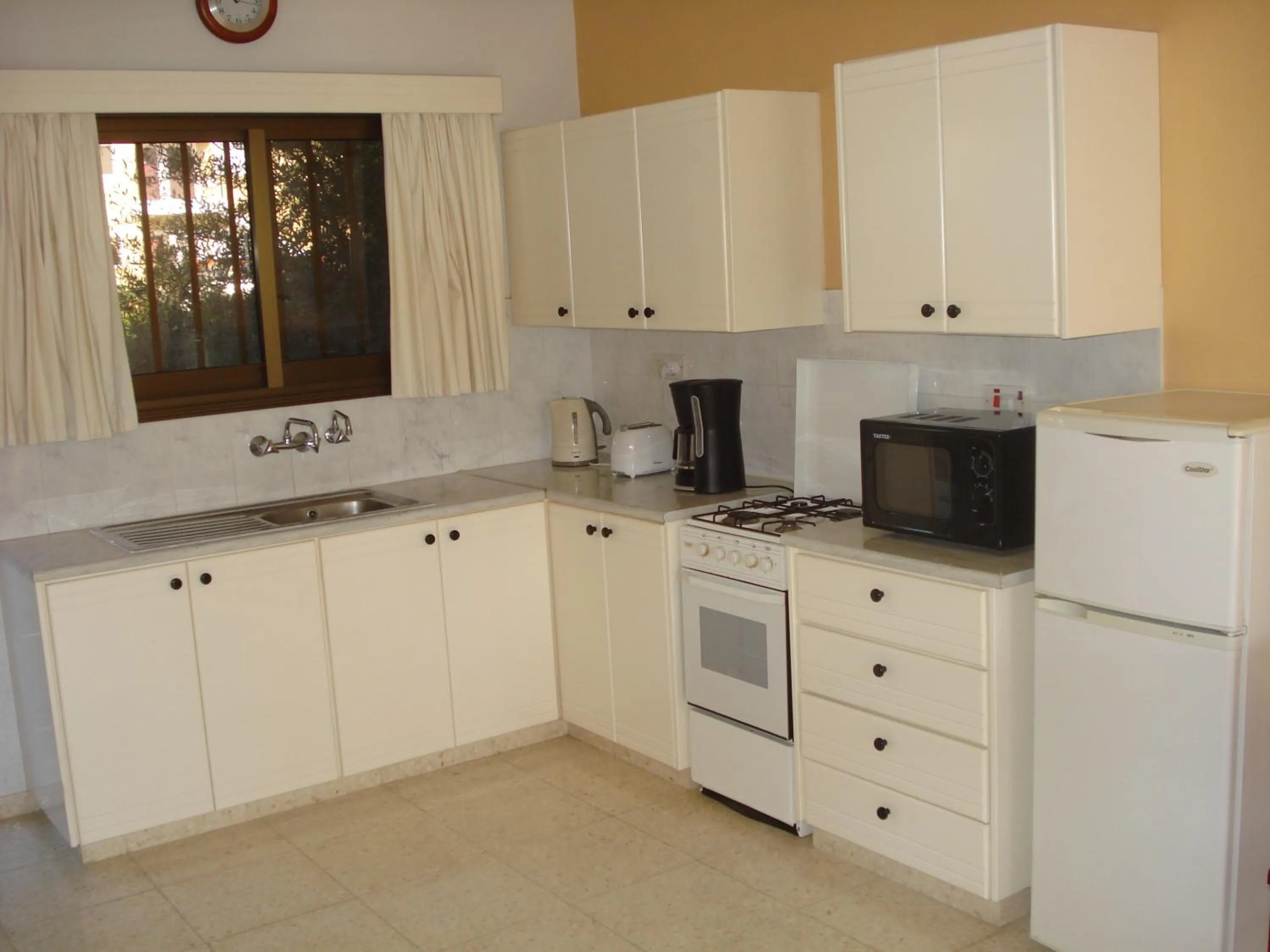 Kitchen or kitchenette in Arilena Holiday Apartments