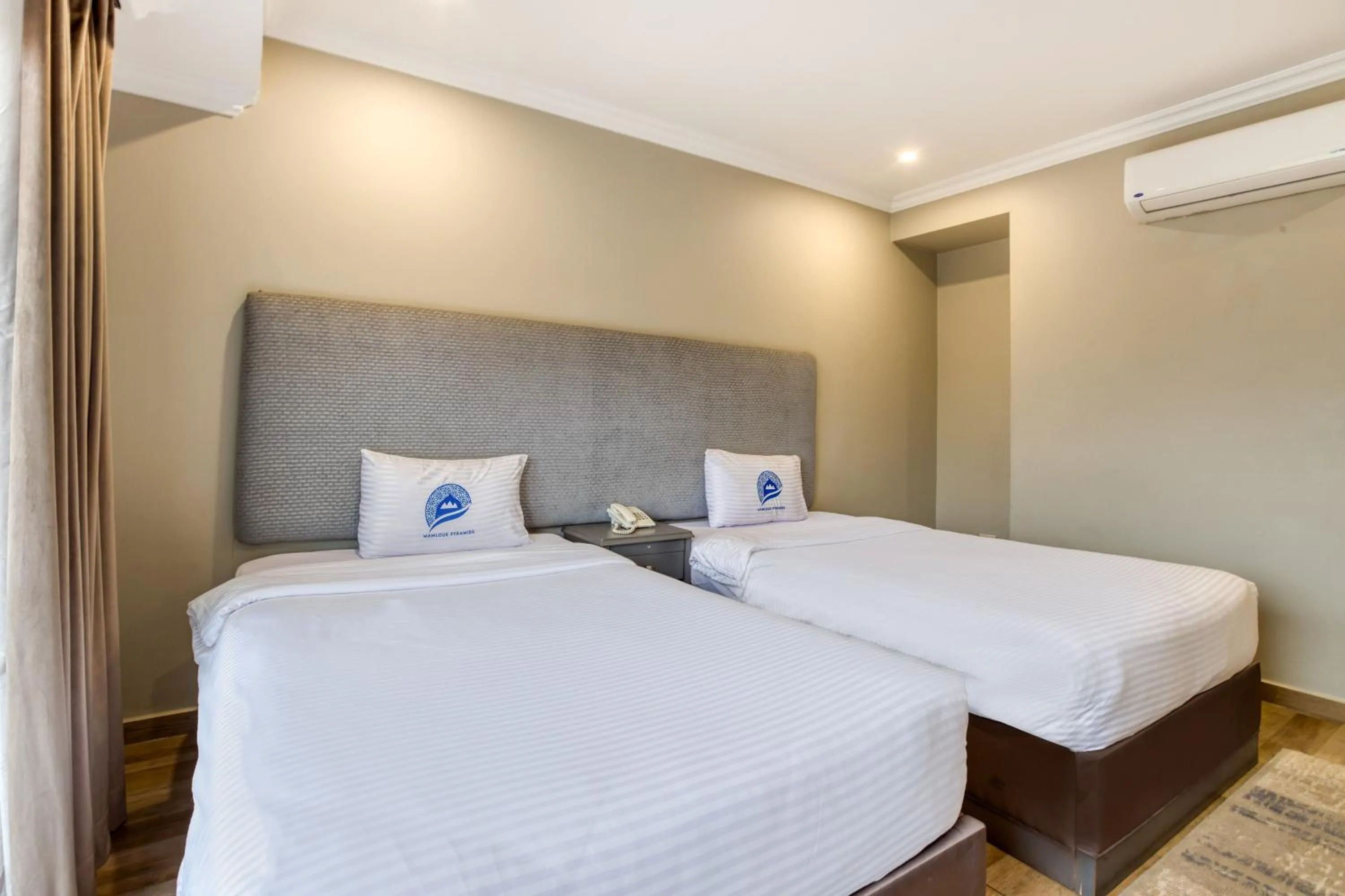 Bed in Mamlouk Pyramids Hotel