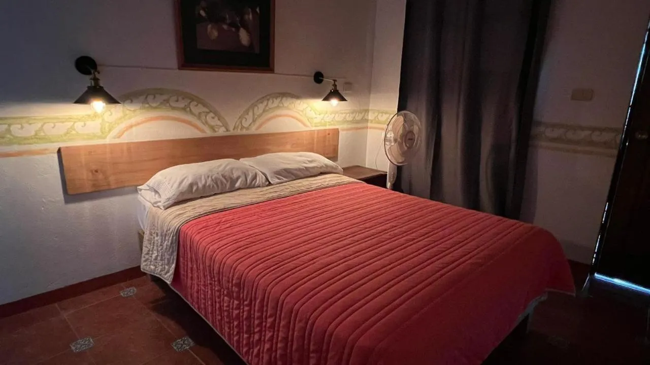 Bed in Posada Los Naranjos