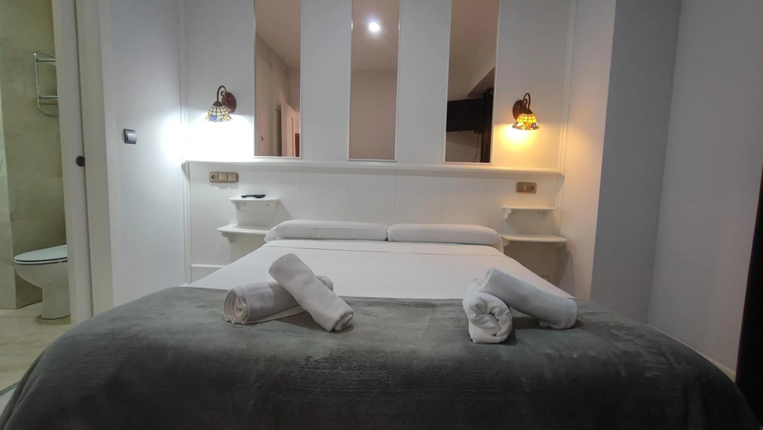 Toilet, Bed in Hotel Aro'S