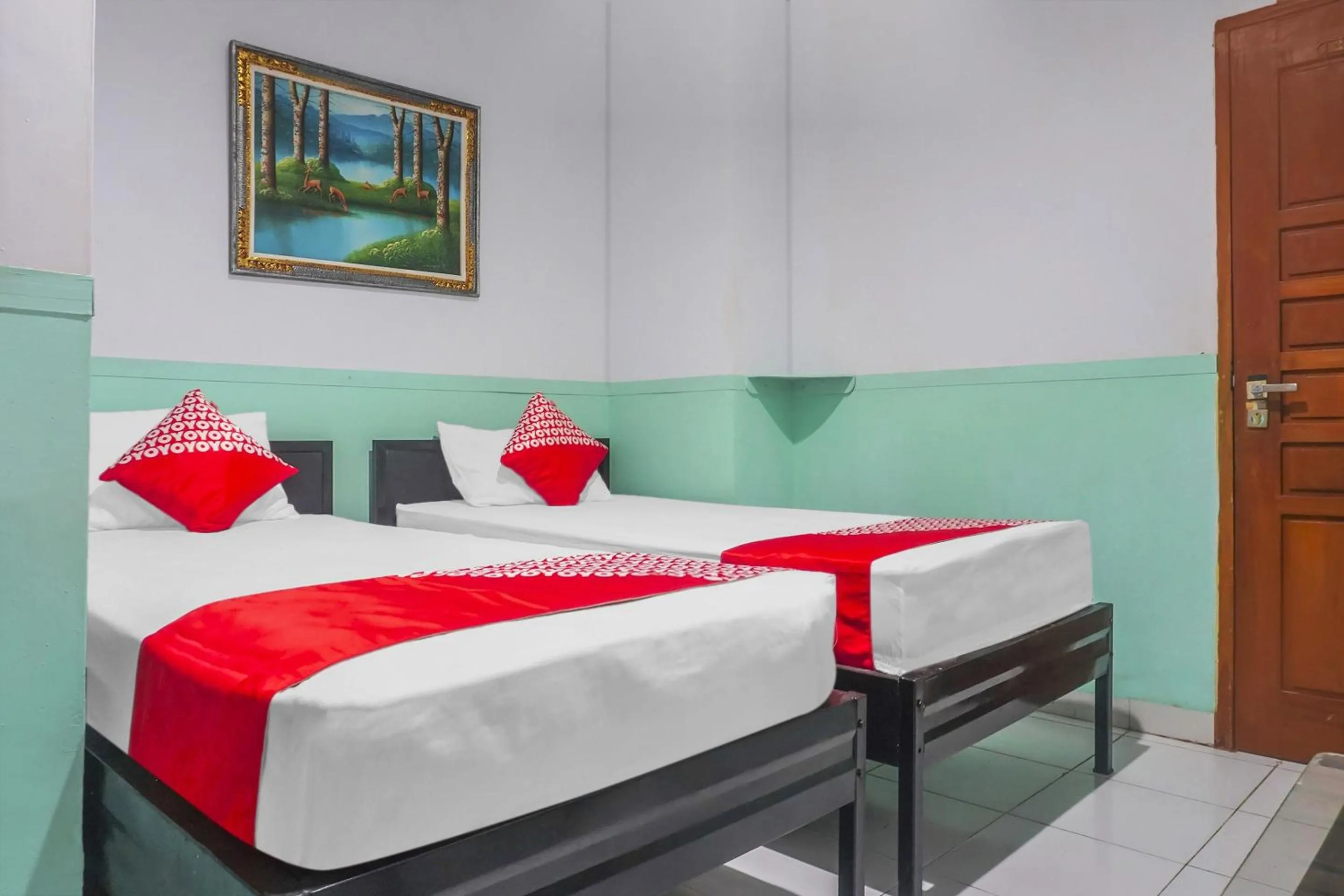 Bedroom in Hotel O Wisma Favorite Makassar Near Benteng Rotterdam