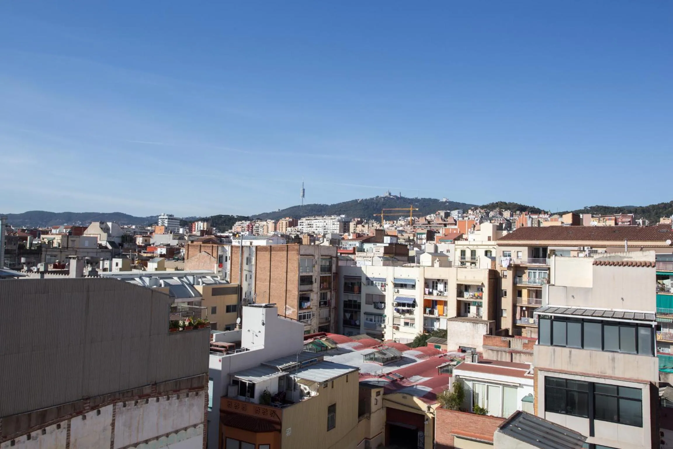 Day in Gaudi penthouse with terrace views