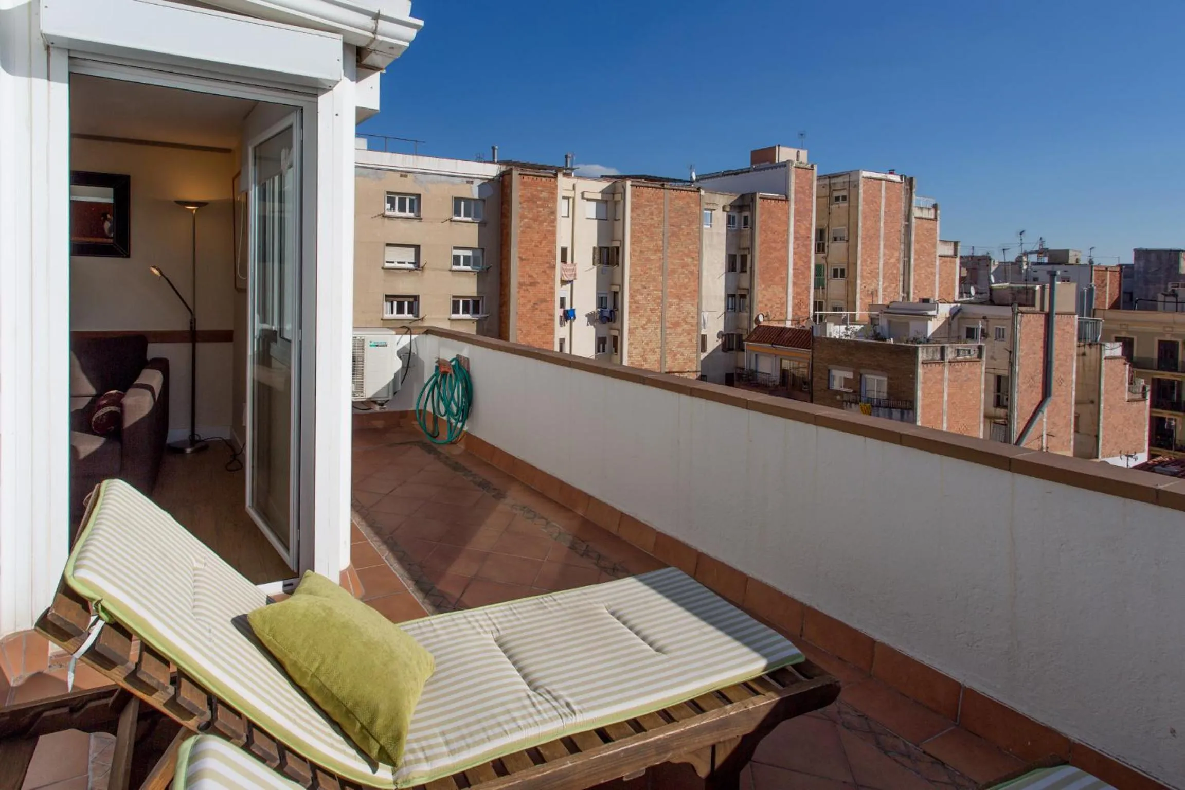 Day in Gaudi penthouse with terrace views