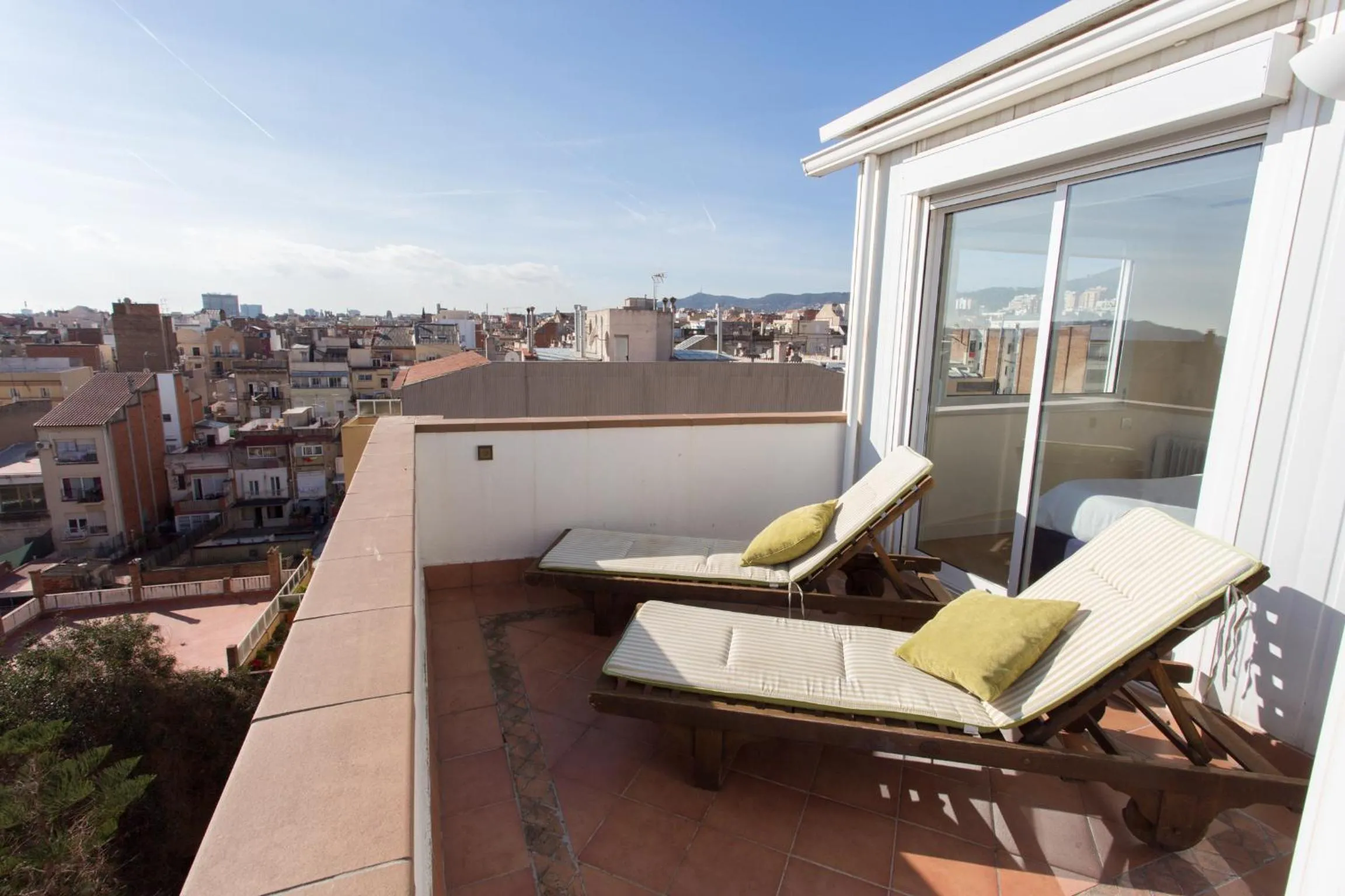 Day in Gaudi penthouse with terrace views