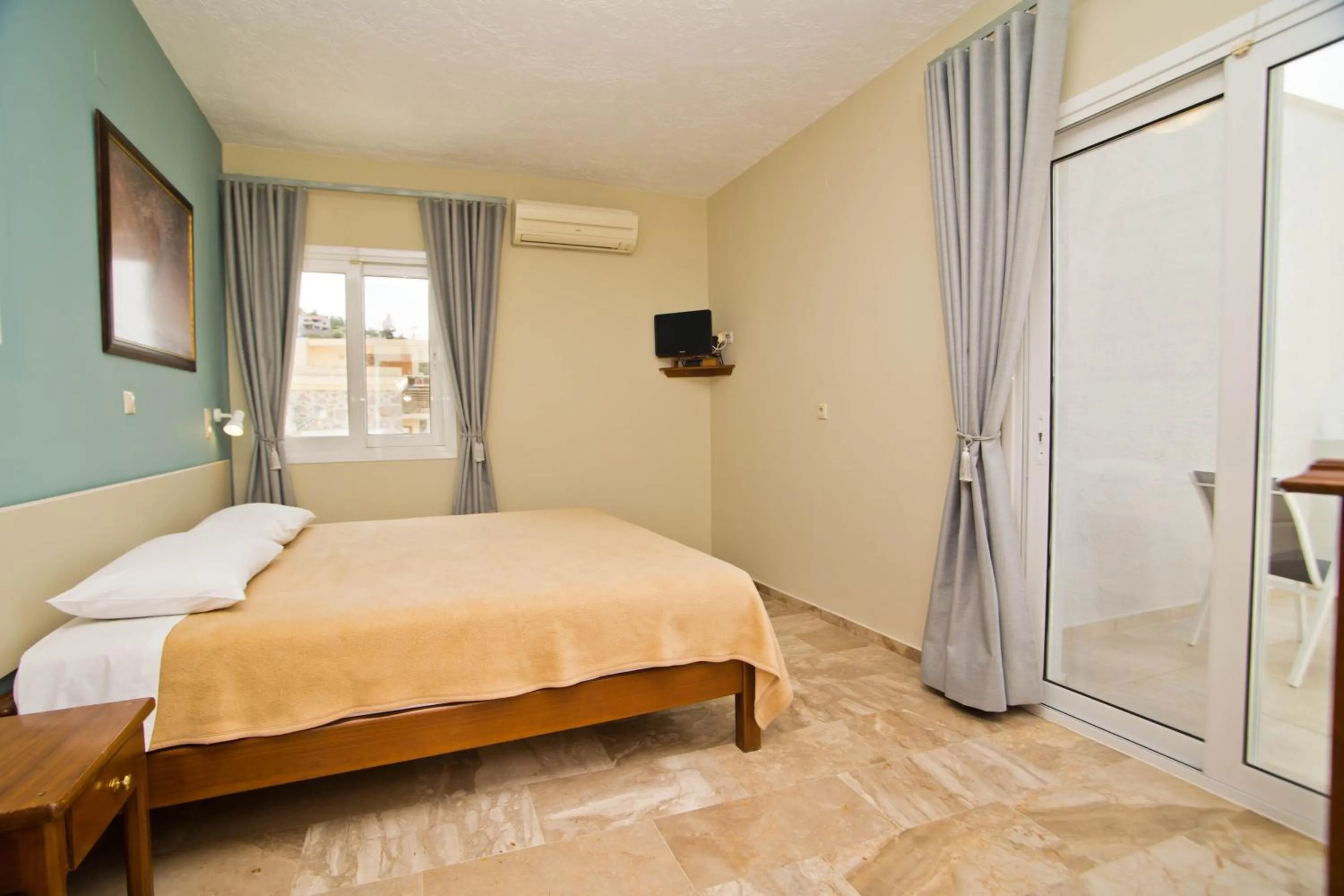 Bed in Acropolis Hotel