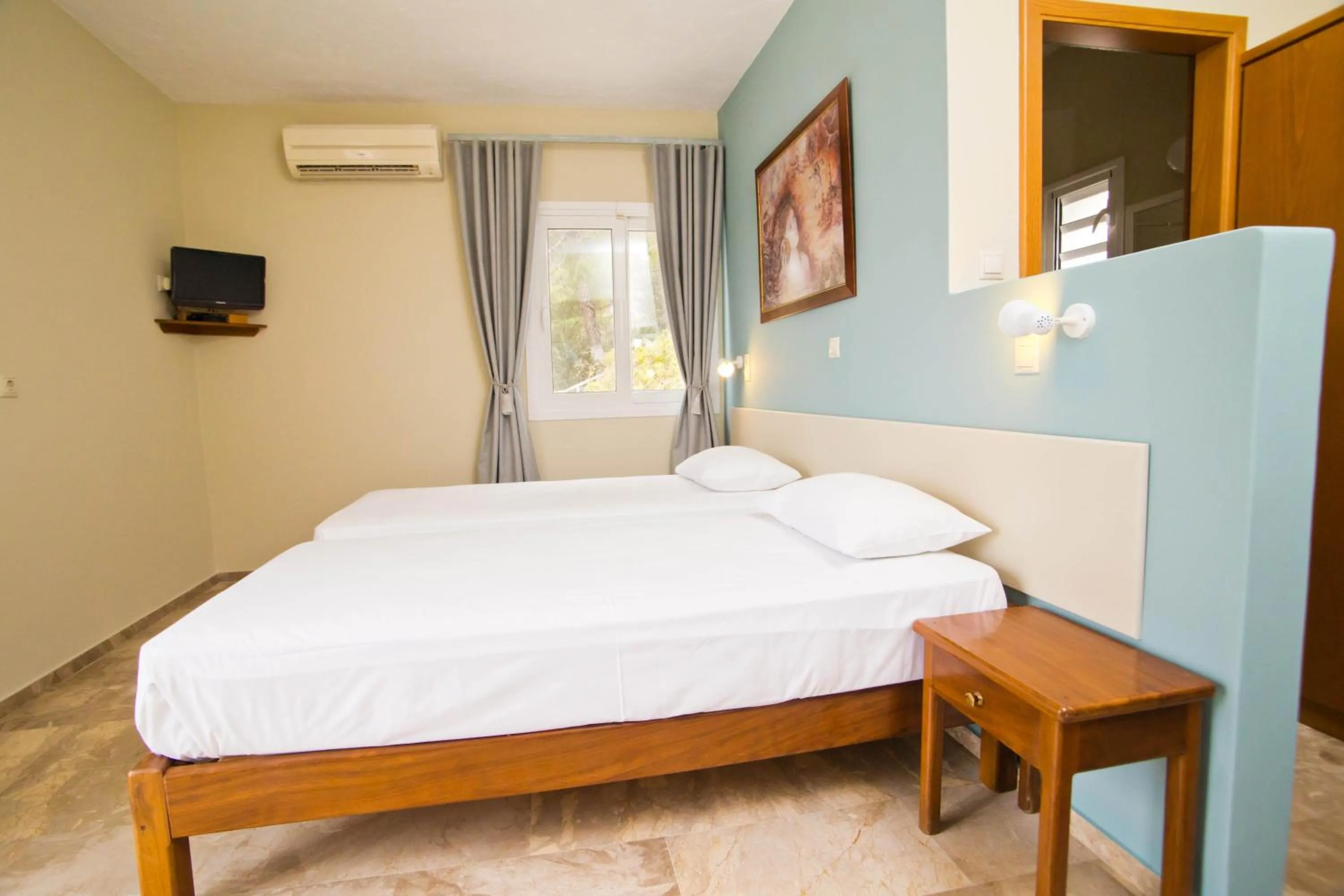 Bed in Acropolis Hotel