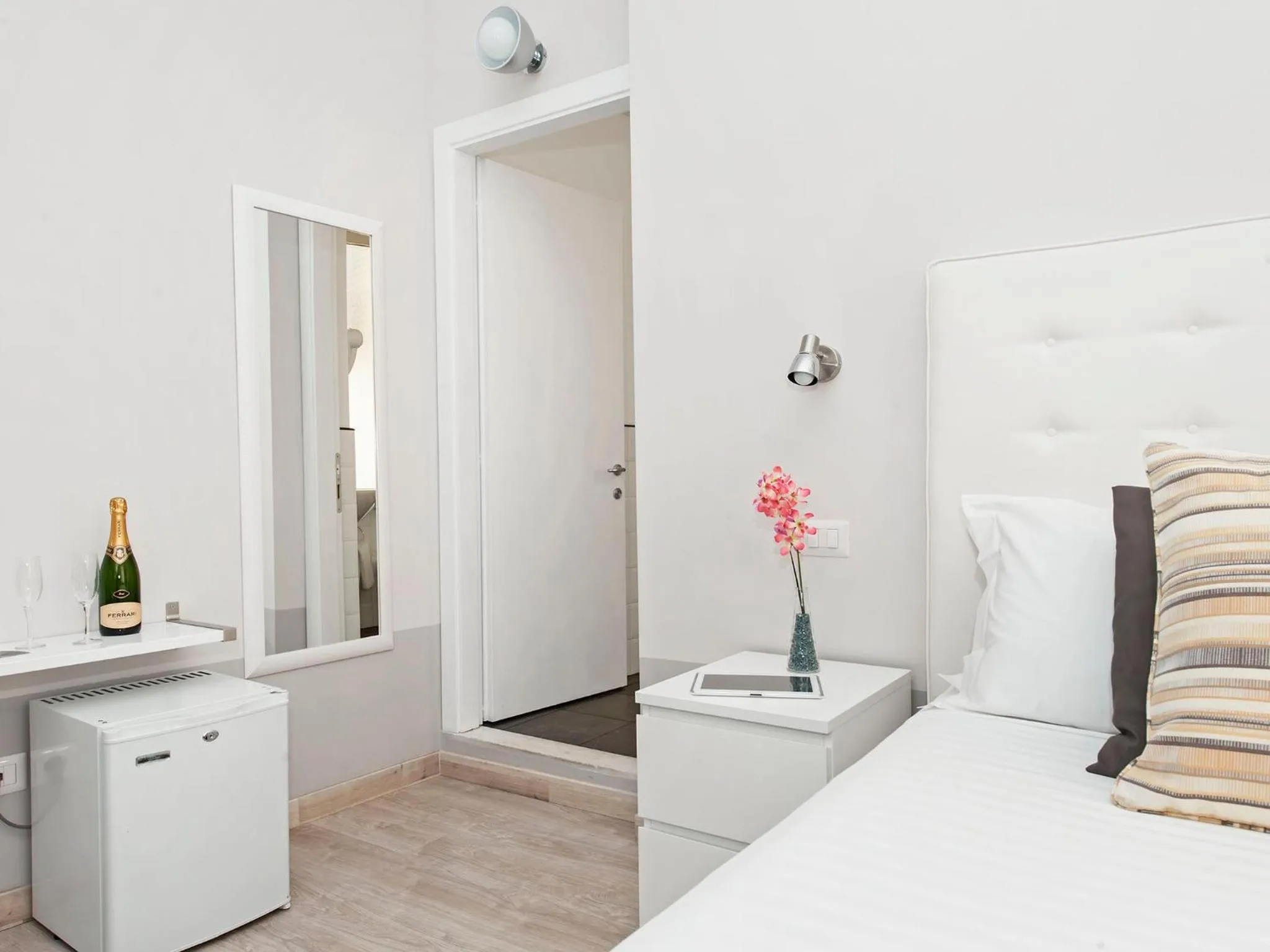 Decorative detail, Bed in White Rooms Colosseo