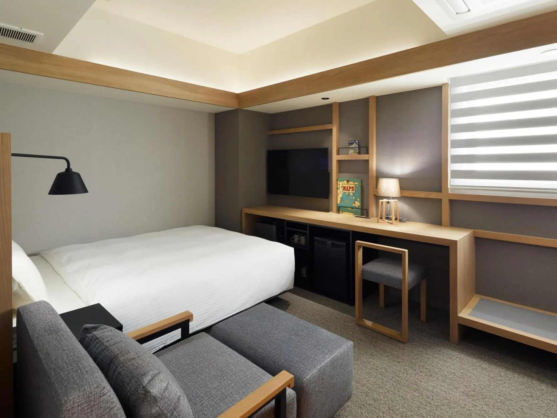 Bed in LAMP LIGHT BOOKS HOTEL sapporo