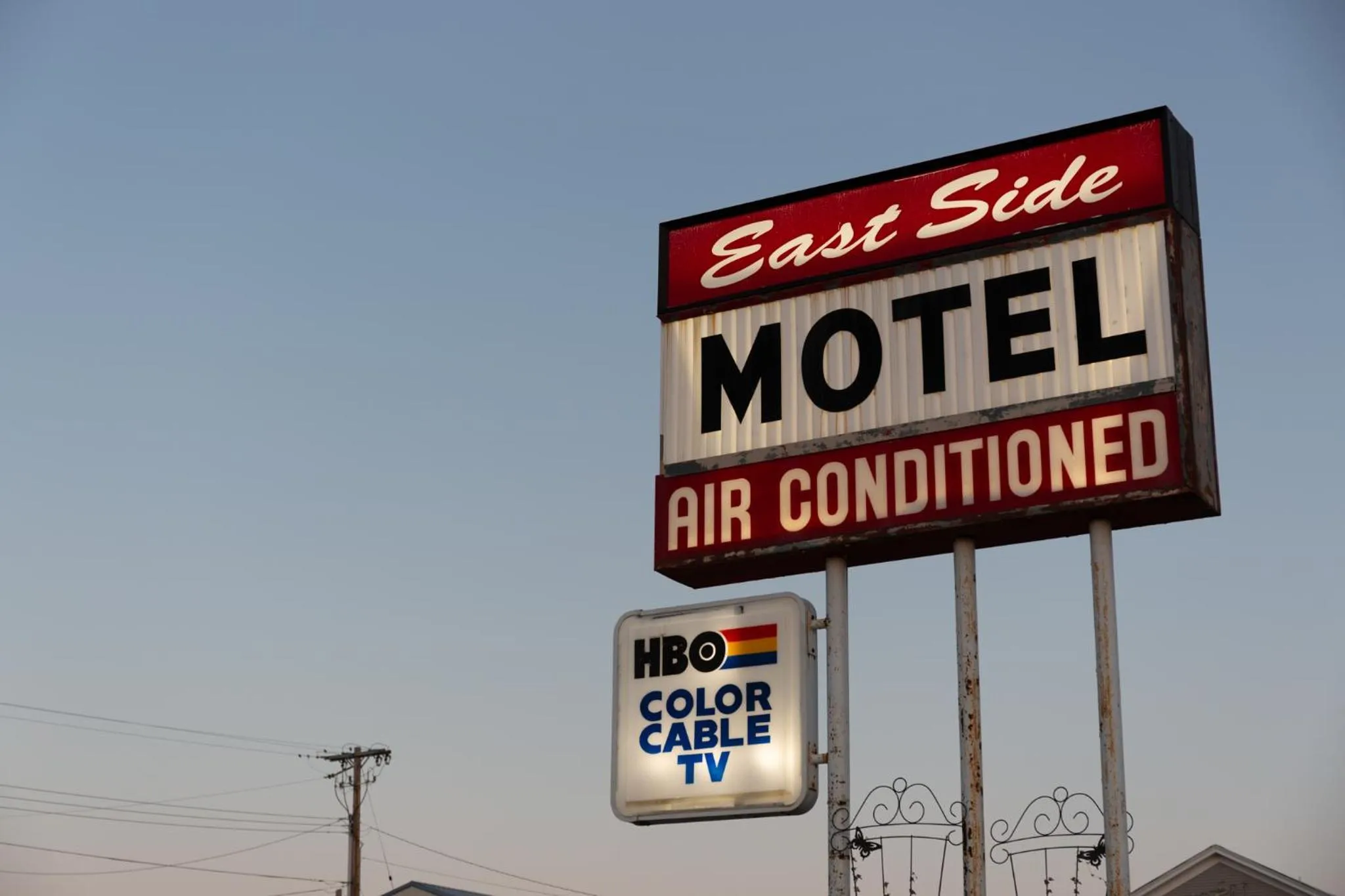 Property logo or sign in East Side Motel & Cabins