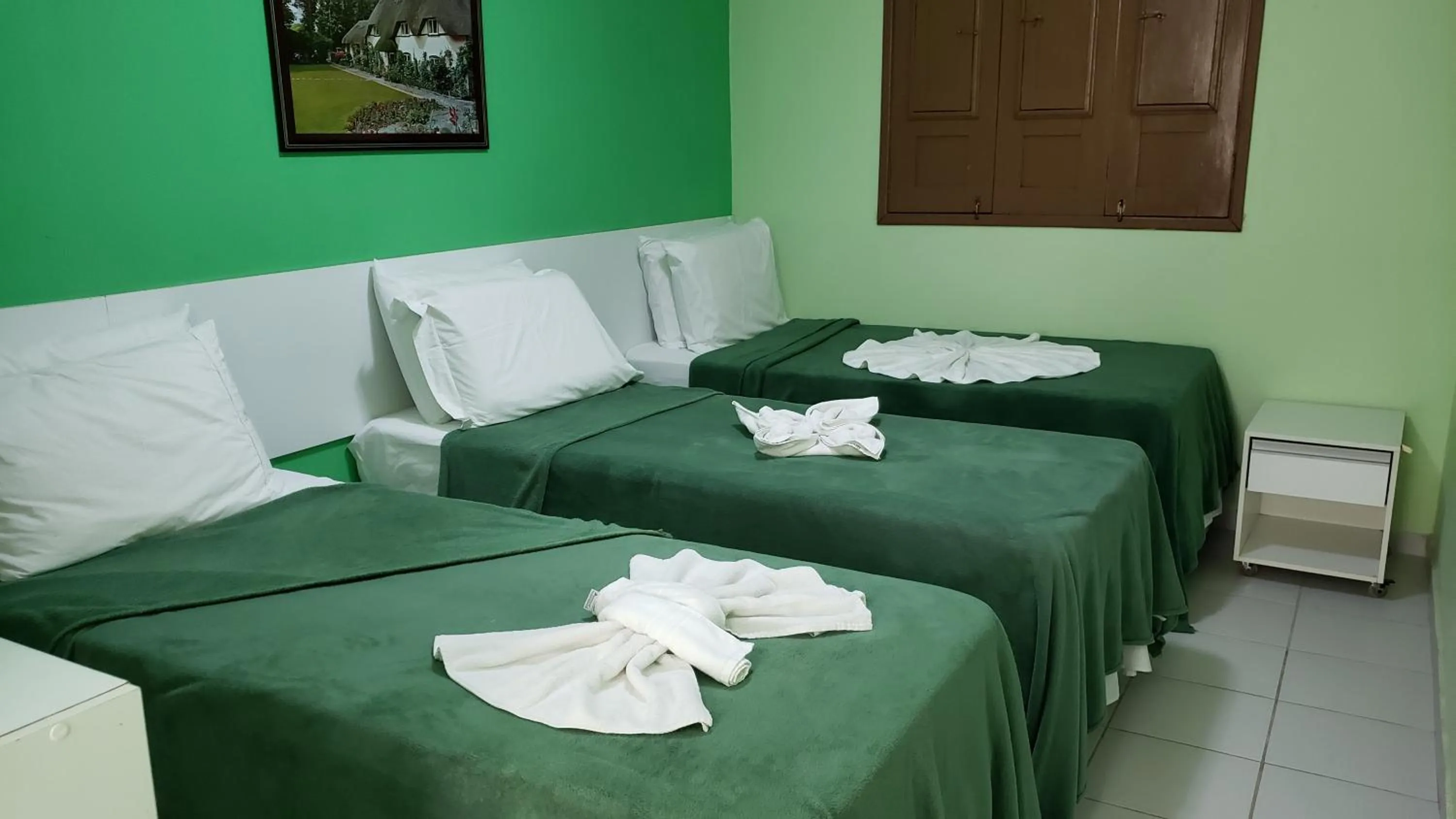 Bed in Pousada Ouriço