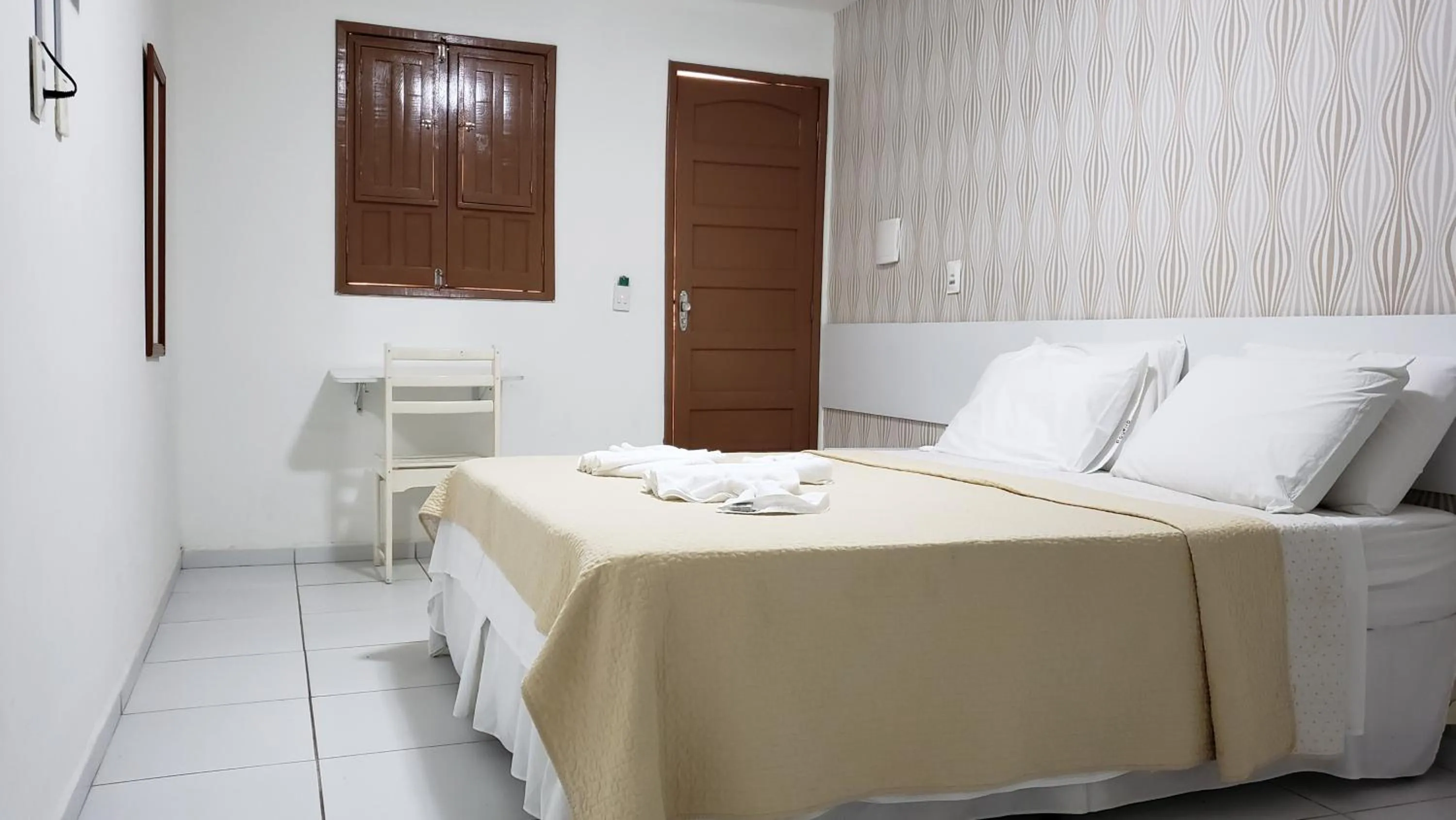 Bed in Pousada Ouriço