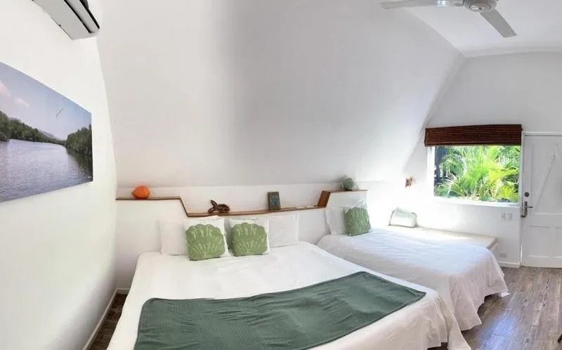 Text overlay, Bed in Punta Rucia Lodge Hotel Boutique & Spa